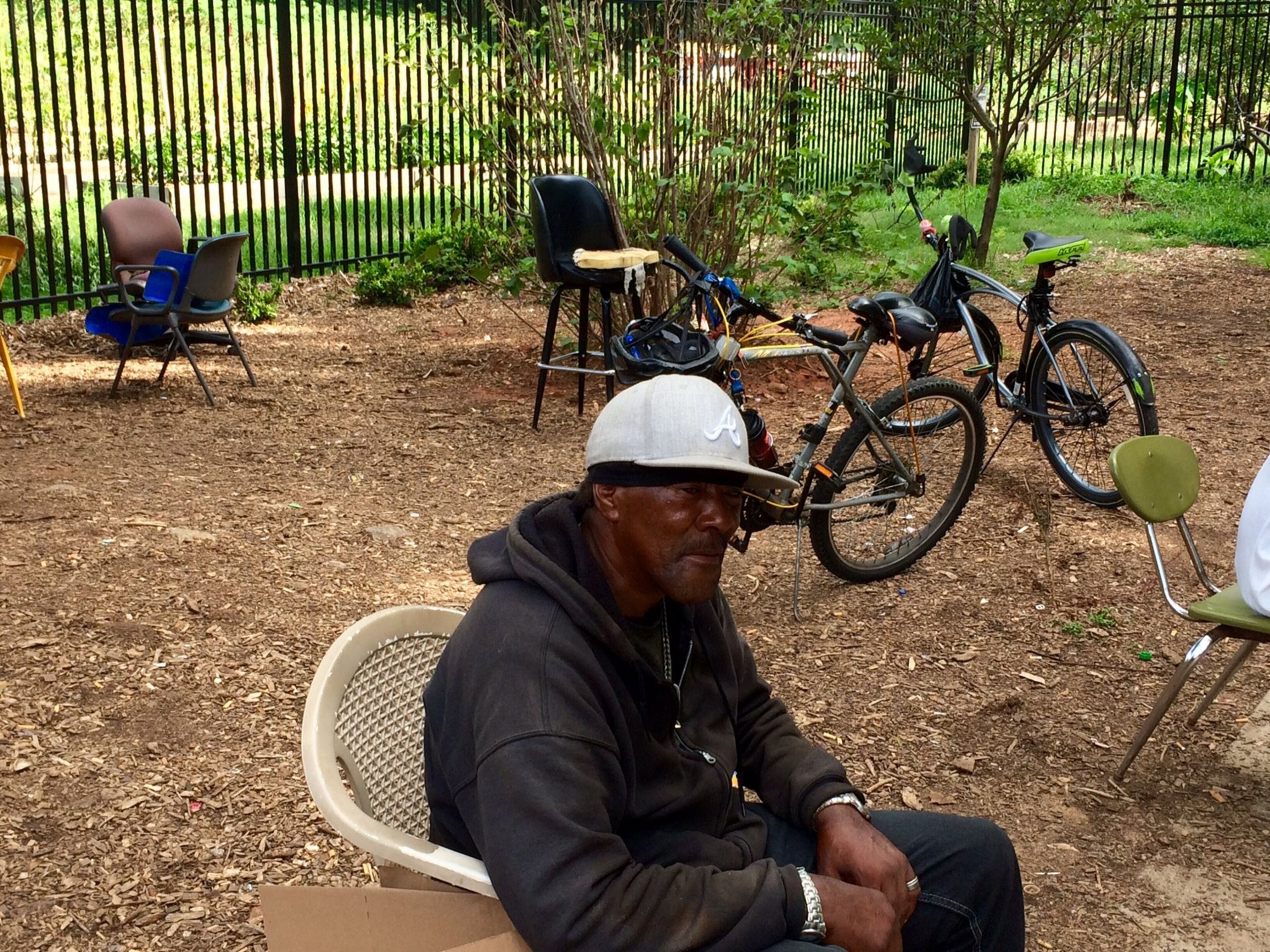 William Harden, his bicycle parked behind him, appreciates the safety brought by bike lanes on Westview Drive in Atlanta. (Photo by Bill Torpy)