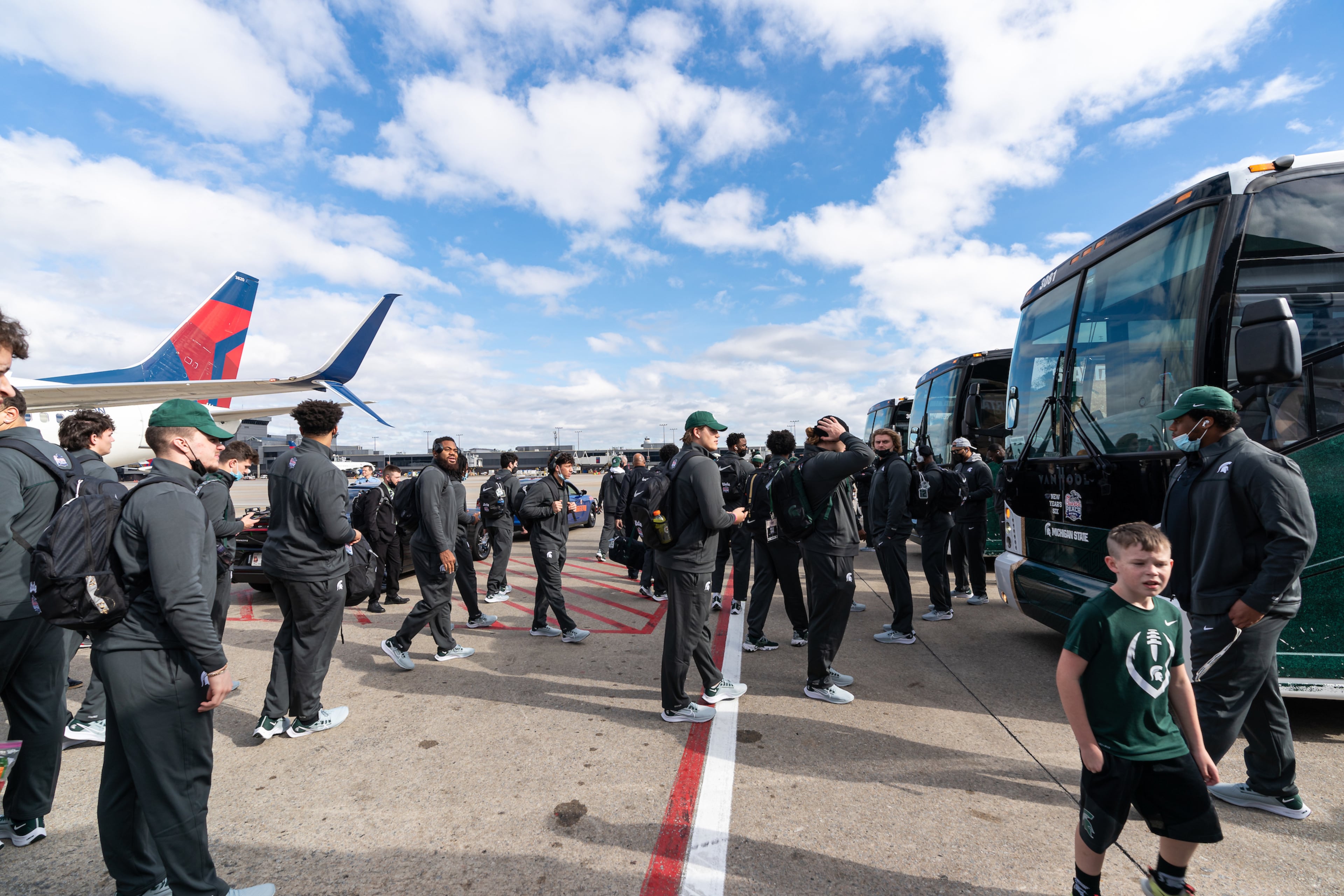 Michigan State arrives at Hartsfield-Jackson Atlanta International Airport for the Chick-fil-A Peach Bowl NCAA college football game Friday, Dec. 24, 2021, in Atlanta, Ga. Michigan State will face Pitt in the game on Dec.30, 2021. (Paul Abell via Abell Images for the Chick-fil-A Peach Bowl)