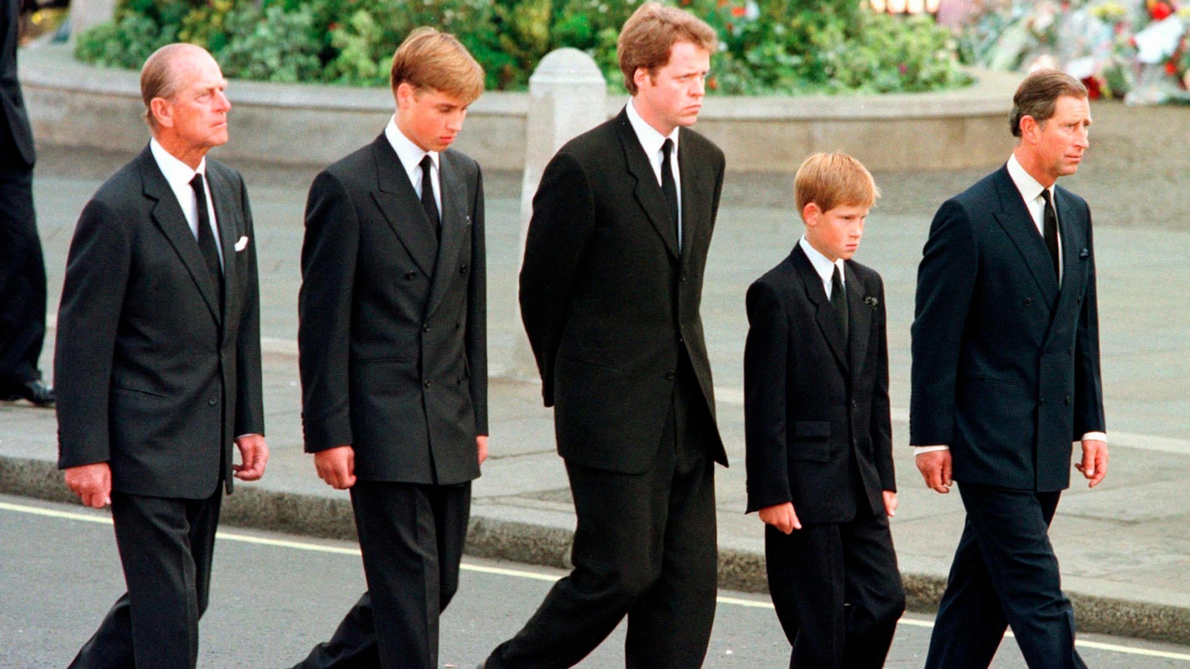 FILE - From left: Britain's Prince Philip, Prince William, Earl Spencer, Prince Harry and Prince Charles walk outside Westminster Abbey during the funeral procession for Diana, Princess of Wales, Sept. 6, 1997. (AP Photo/Jeff J. Mitchell, Pool, File)