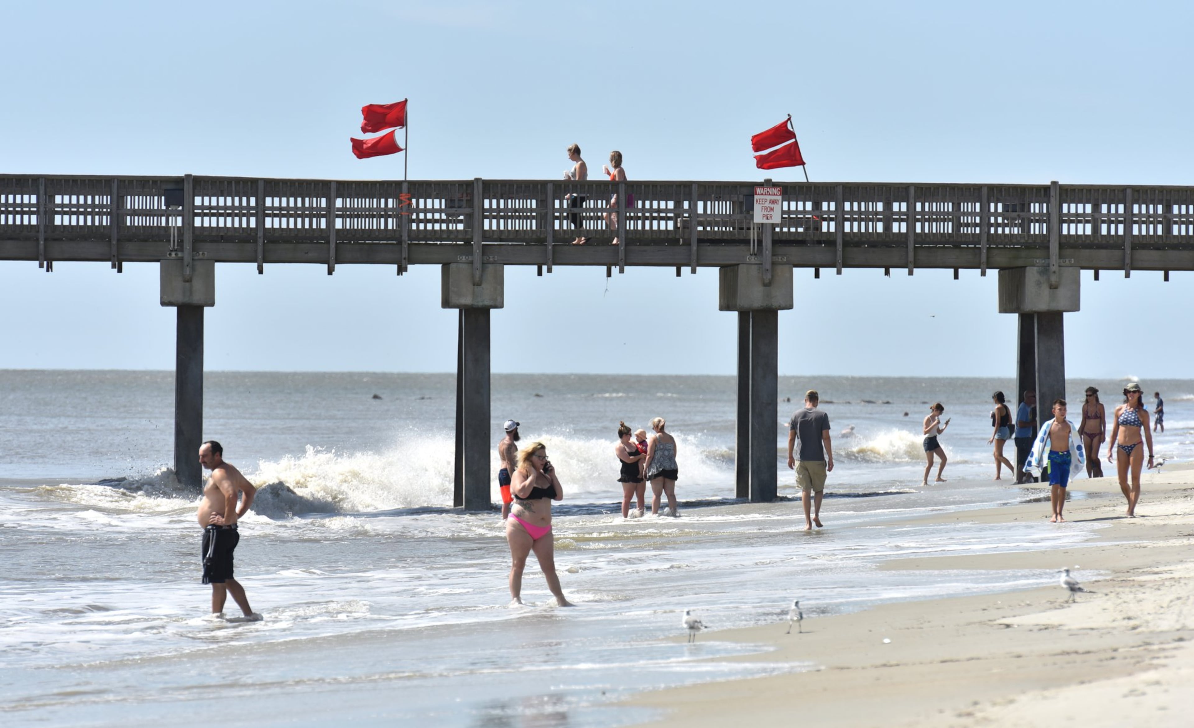 FILE - Beachgoers enjoy themselves on Tybee Island. HYOSUB SHIN / HSHIN@AJC.COM