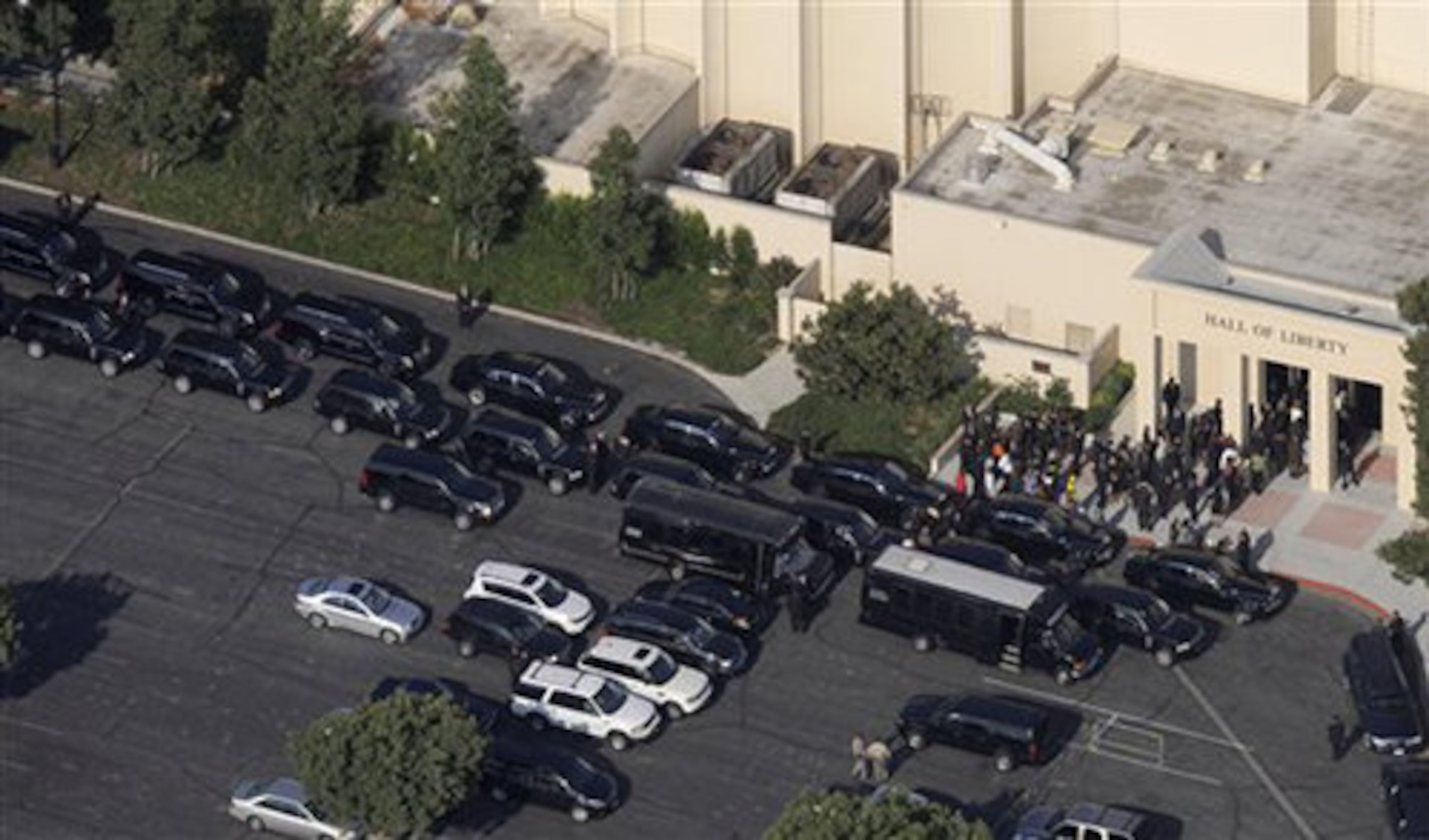 Mourners begin to gather at Forest Lawn Memorial Park.