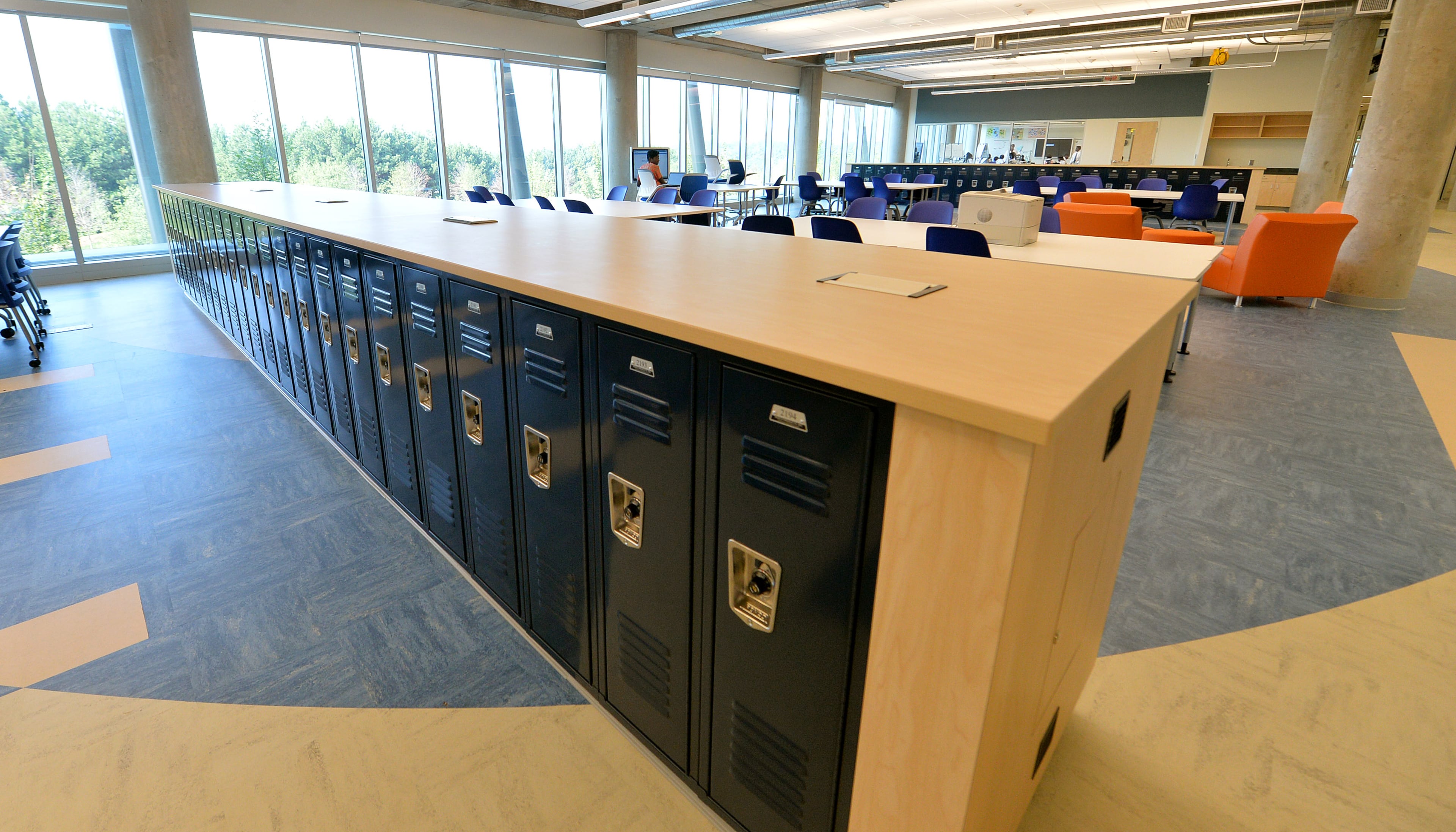 Lockers, once located in long hallways, have been moved to open up additional work spaces for teachers and students.