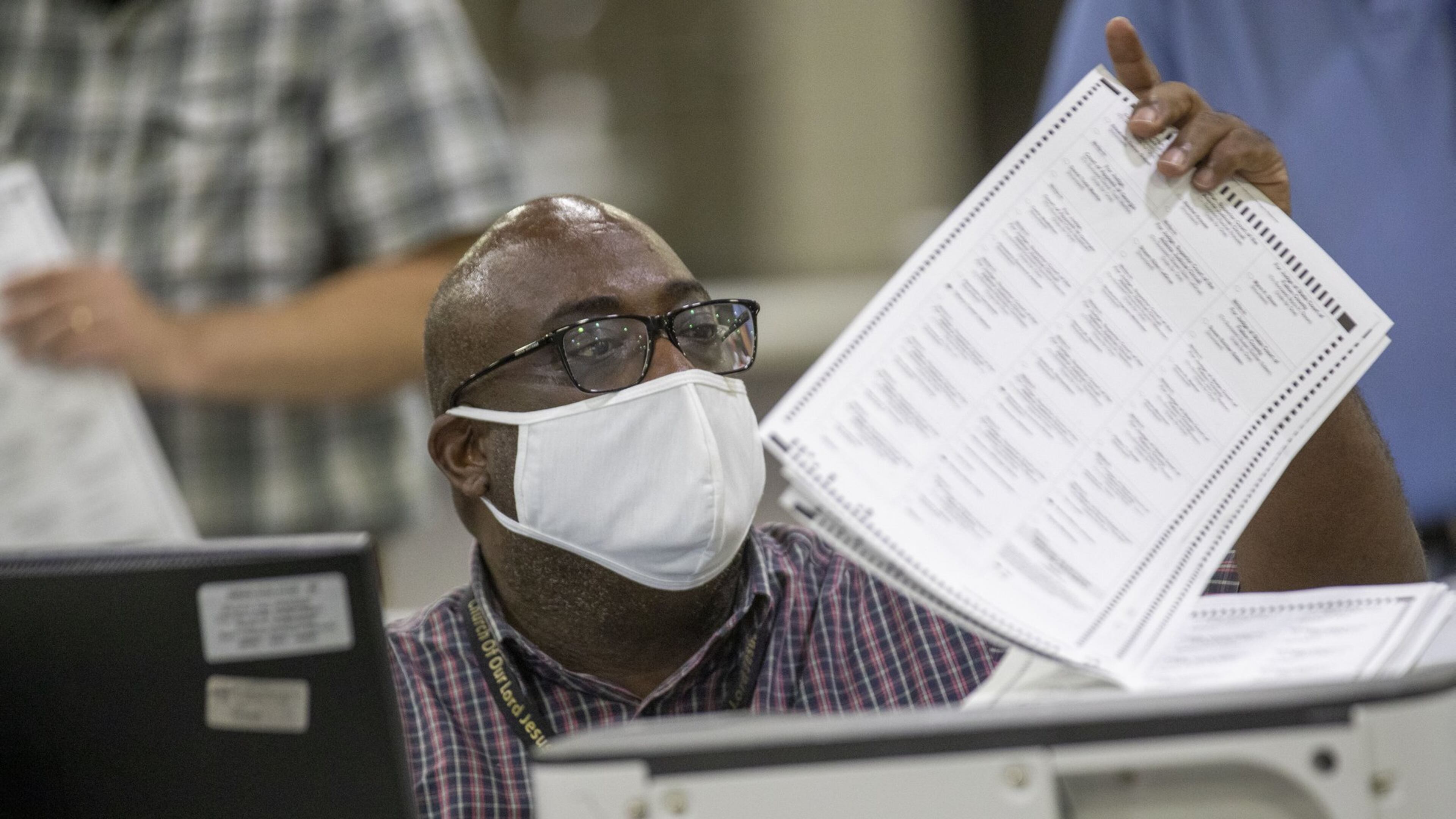 Fulton County employees continue to count mail-in ballots the day after the Georgia primary election at the Georgia World Congress Center in Atlanta, Wednesday, June 10, 2020. A spokesperson for Fulton County said that they will announce the final number of mail-in ballots on Wednesday. (ALYSSA POINTER / ALYSSA.POINTER@AJC.COM)