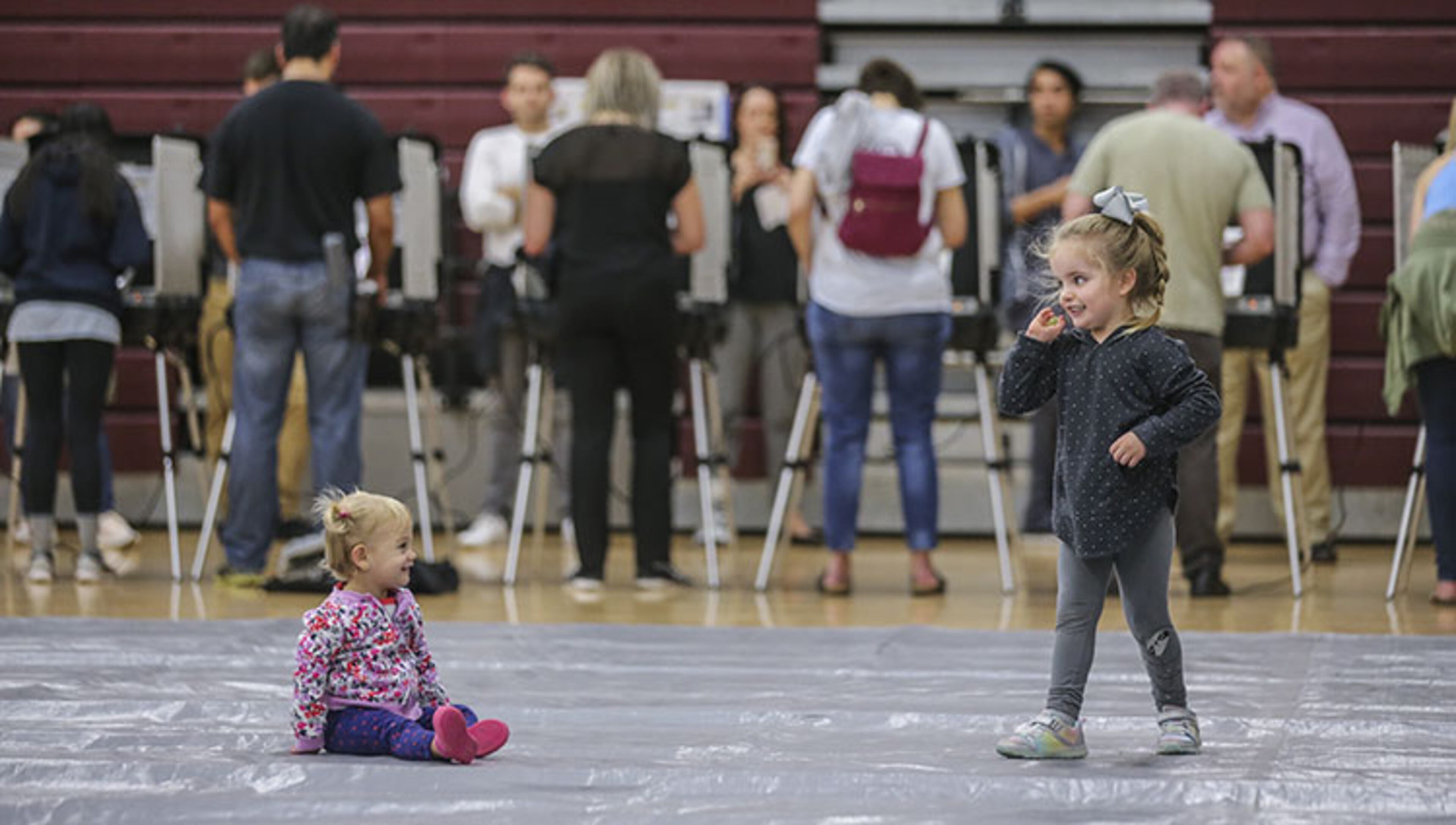 November 6, 2018 Atlanta : Sofia Morley - 2 (left) and Vesper Langford-3 (right) played as voters waited over an hour to vote at Henry W. Grady High School at 29 Charles Allen Dr NE, in Atlanta on Tuesday Nov. 6, 2018. Metro Atlanta polling places reported steady lines as voters went to the polls Tuesday. Georgia voters were asked Nov. 6 whether the state constitution should be amended to give a 10-year, $200 million boost to land conservation, solidify the state’s commitment to crime victims and cut timberland taxes. Five proposed amendments appeared on the ballot, which most notably settles the long and hard-fought races for governor and other key offices. JOHN SPINK/JSPINK@AJC.COM