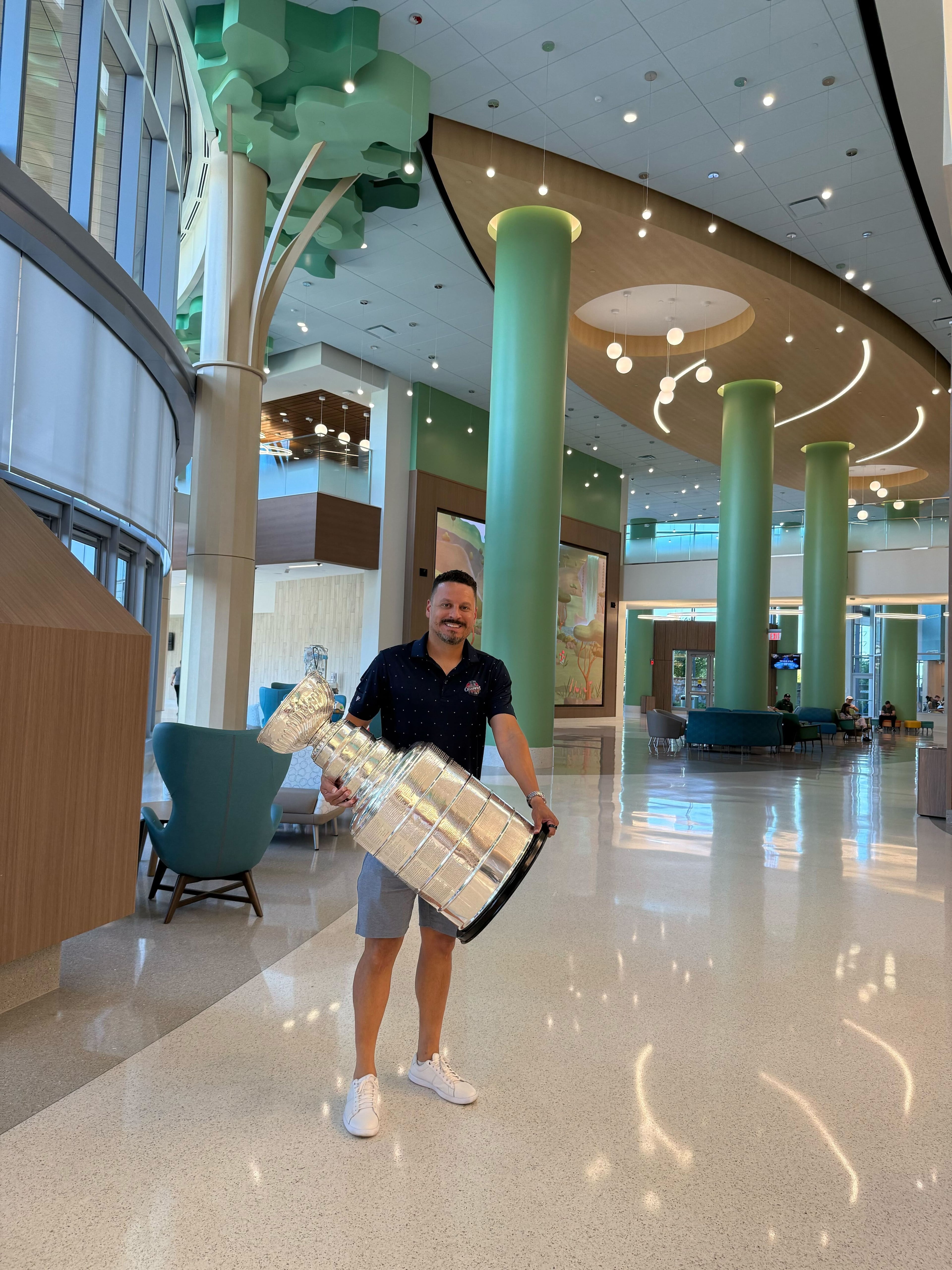Mike Huff, an executive with the NHL champion Florida Panthers, with the Stanley Cup at Children's Healthcare of Atlanta. (Courtesy of Brad Pendergrass)