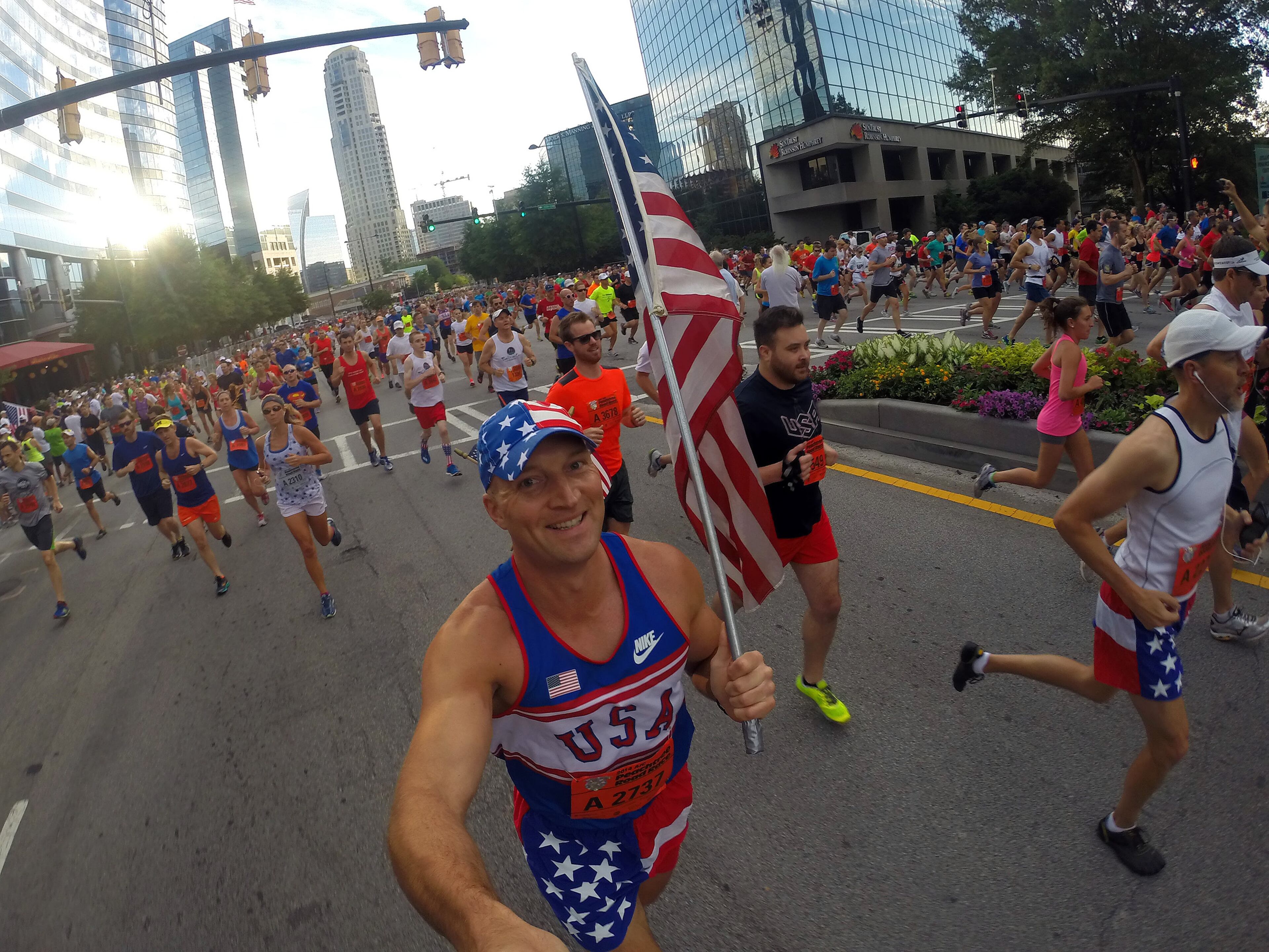 For most people, the AJC Peachtree Road Race is all about getting out and having fun with 60,000 other revelers. With that in mind, AJC Photojournalist Ben Gray passed a camera to runners as he made his way South on Friday morning July 4, 2014 and shot "selfies" of the runners as they carried the camera. BEN GRAY / BGRAY@AJC.COM