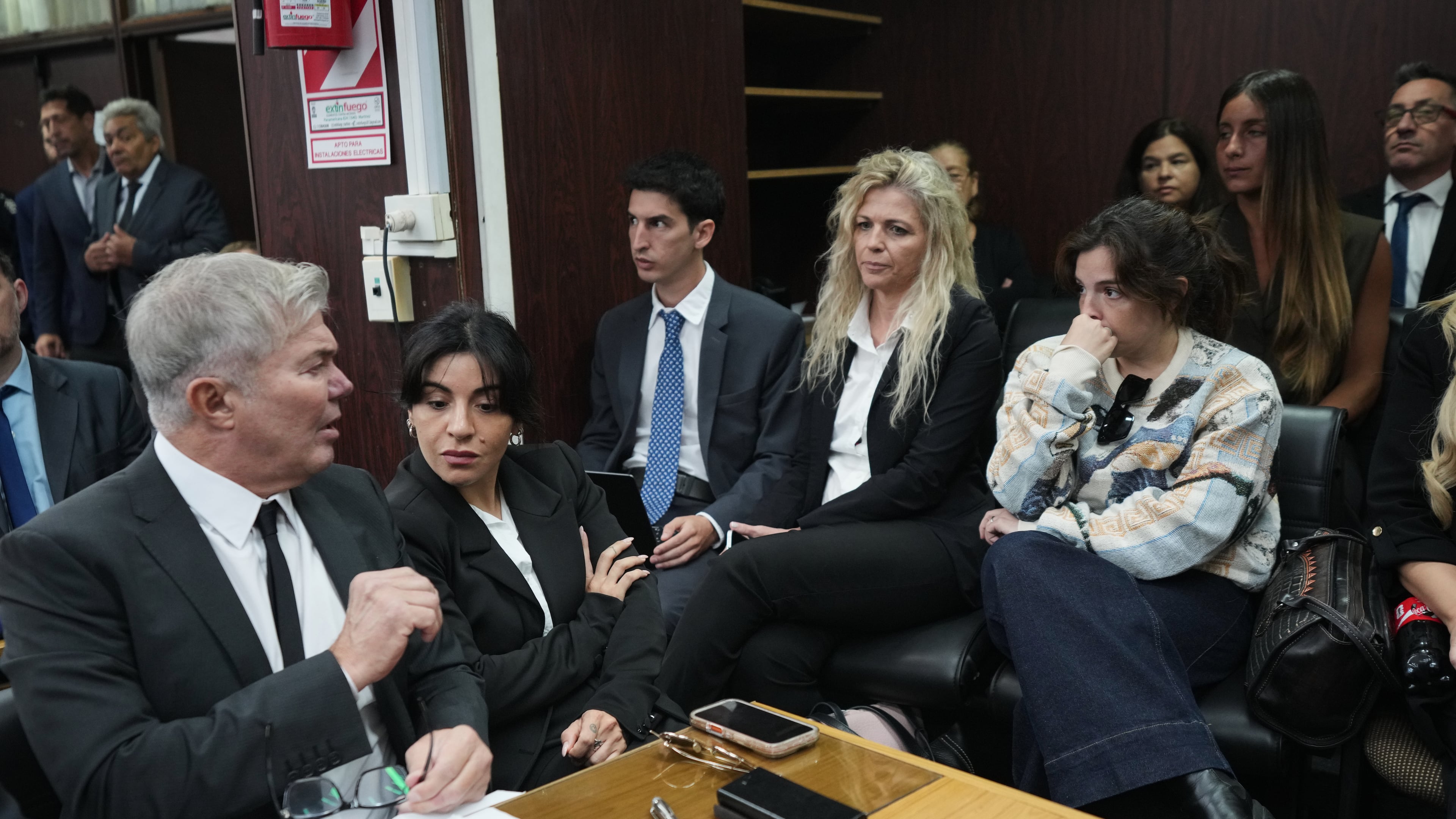 Dalma Maradona, right, and Gianinna Maradona, second left, daughters of late soccer star Diego Maradona attend the first day of the trial over allegations of homicide by negligence against the medical team that treated their father in San Isidro, Argentina, Tuesday, April 14, 2026. (AP Photo/Rodrigo Abd)