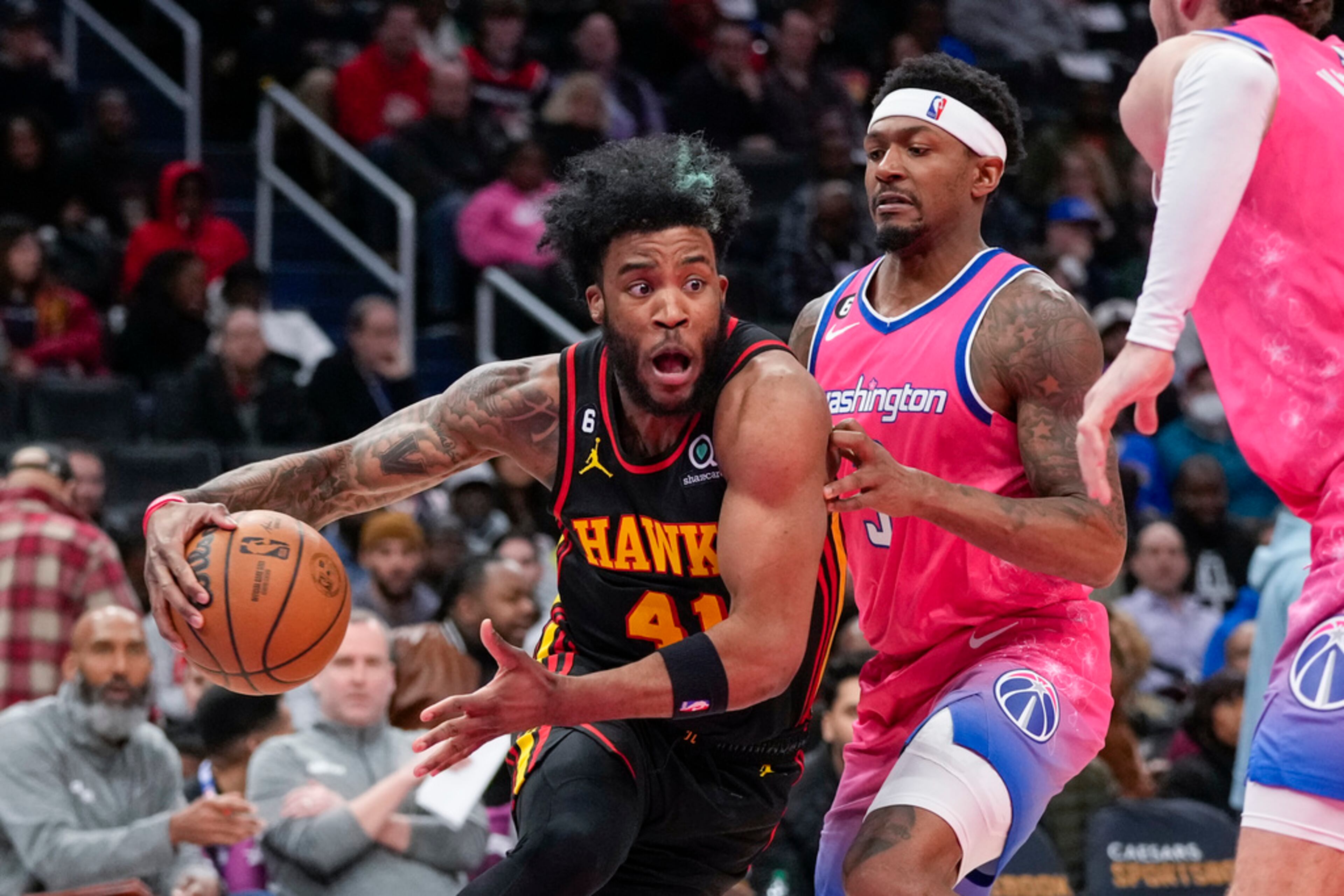 Atlanta Hawks forward Saddiq Bey (41) drives past Washington Wizards guard Bradley Beal (3) during the second half of an NBA basketball game Wednesday, March 8, 2023, in Washington. The Hawks won 122-120. (AP Photo/Alex Brandon)