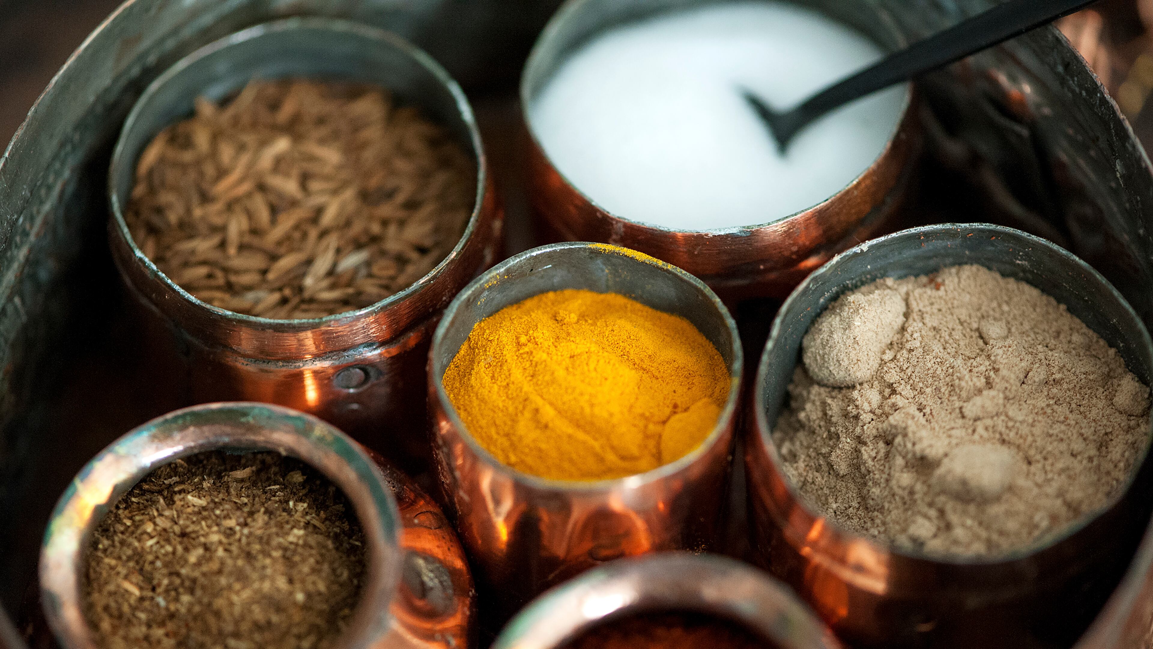 The loondani -- a container for spices made of beaten copper -- that the Sikh businessman Sonny Caberwal received from his mother before going to college, in New York, Jan. 13, 2016. Caberwal's favorite dish, rajma, uses almost every spice in the loondani, which here contains salt, cumin, coriander, red chile, mango powder and turmeric.