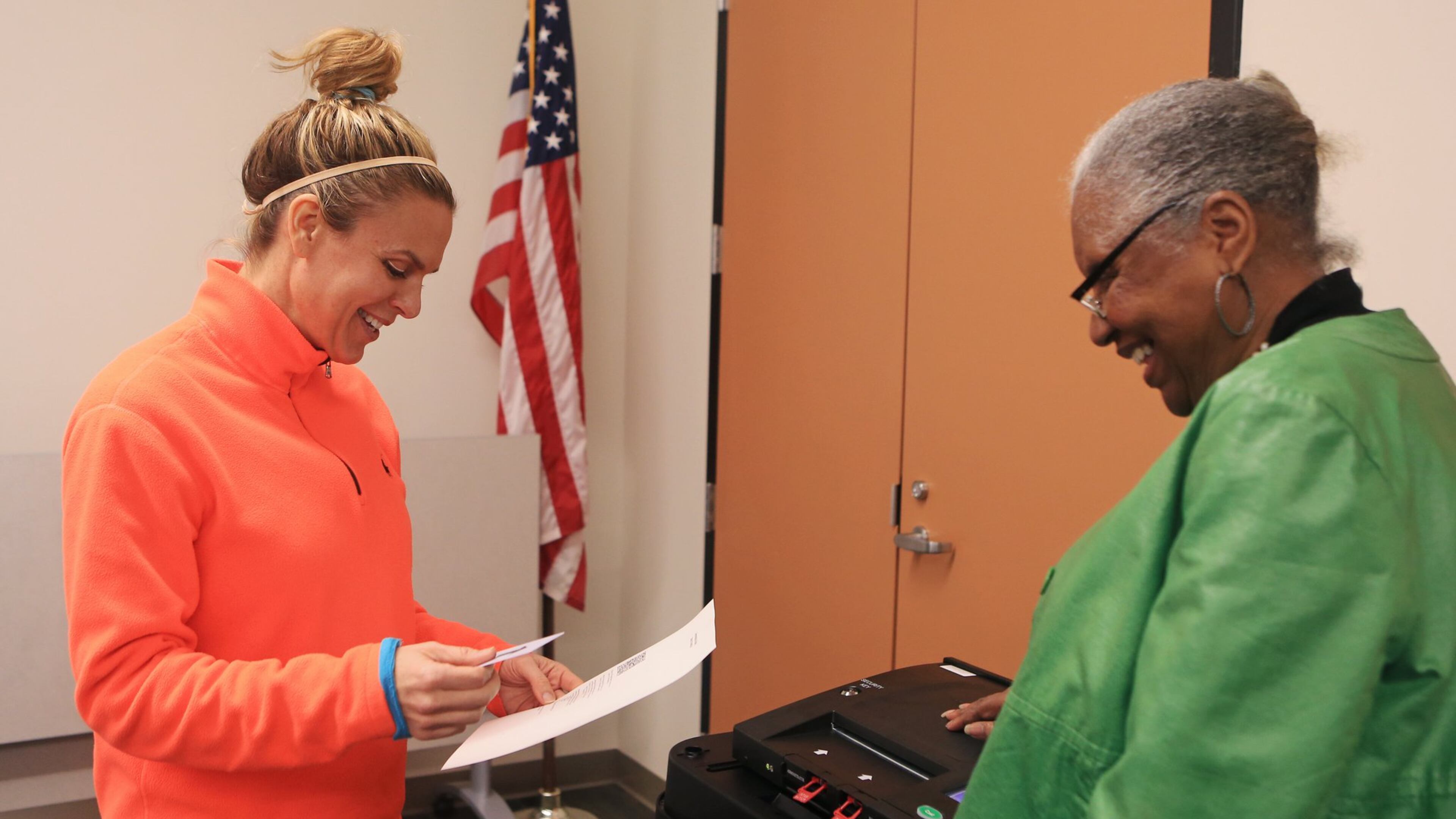 Theresa Carrington (right) helps Karla Pied (left) cast her ballot during the mock election for Fulton County on Tuesday, February 18, 2020, at the Roswell Library in Roswell, Georgia. Fulton County held a mock election to test out its new voting machines and system. (Christina Matacotta for the Atlanta Journal-Constitution)