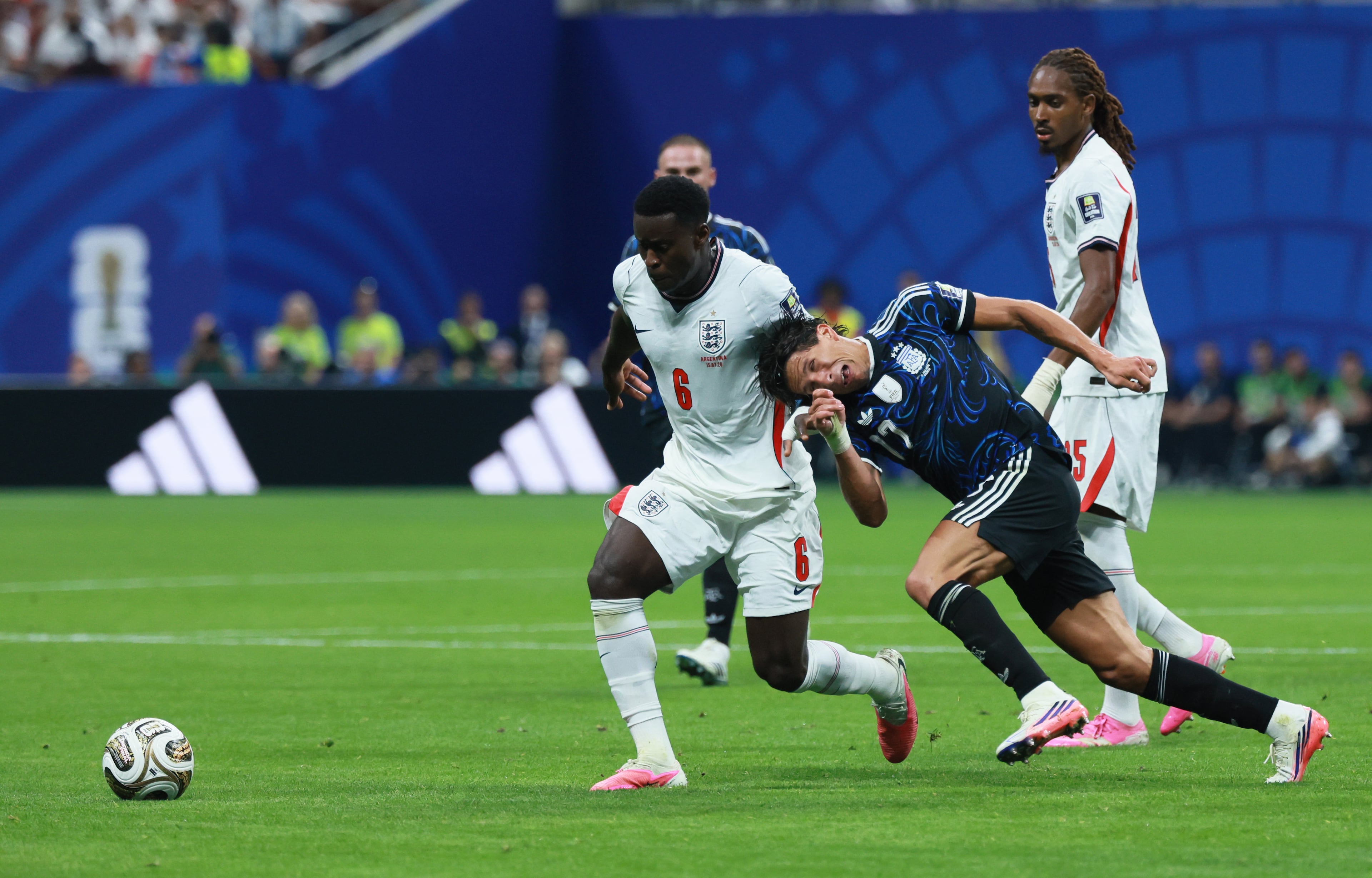 Argentina's Giuliano Simeone, right, fouls England's Marc Guehi during first half of Argentina vs. England FIFA World Cup Semifinal match at Atlanta Stadium (Mercedes-Benz Stadium) on Wednesday, July 15, 2026. (Jason Getz/AJC)