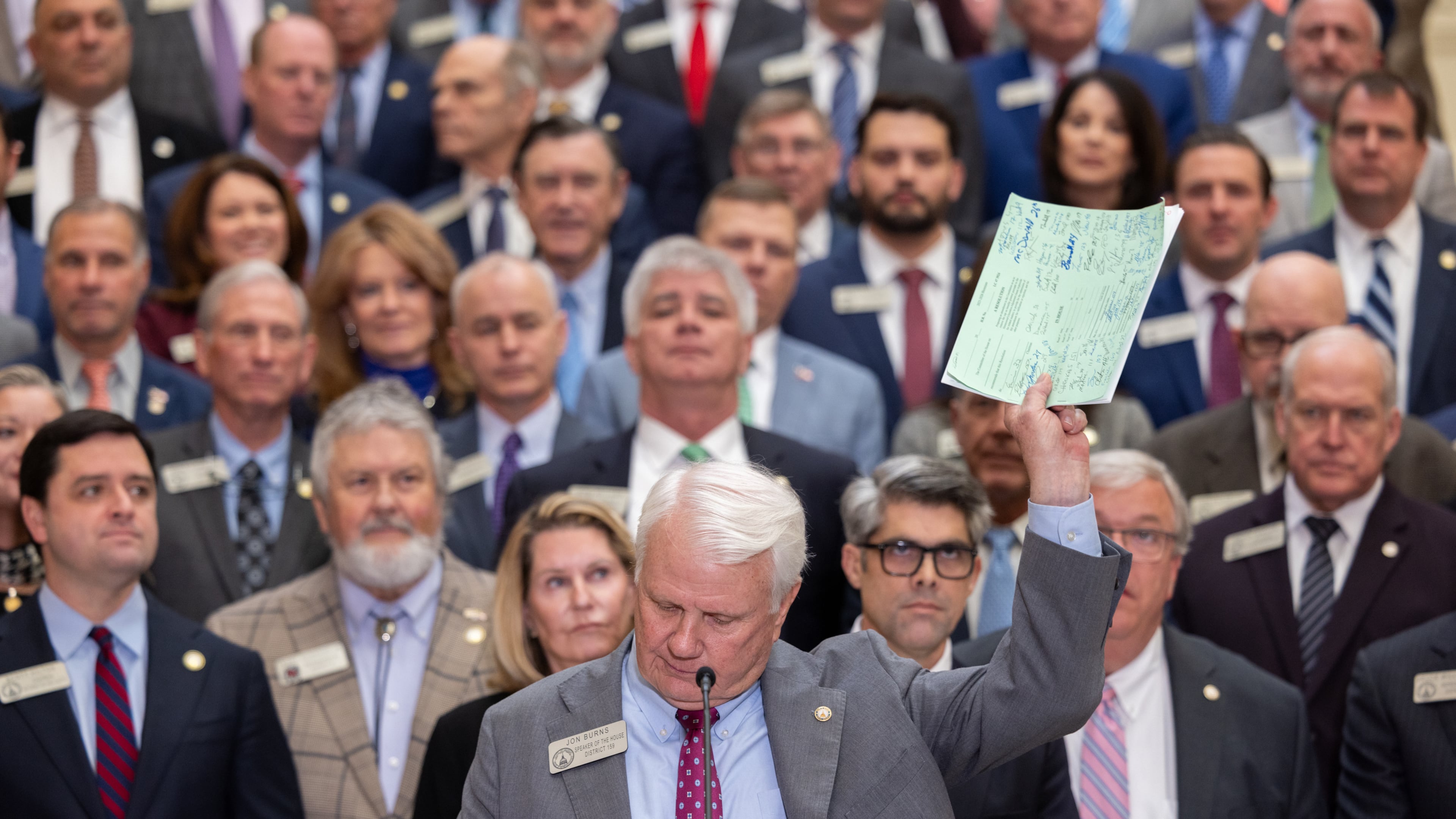 House Speaker Jon Burns holds up proposed property tax relief legislation during a press conference at the Capitol in Atlanta on Wednesday, Jan. 28, 2026. (Arvin Temkar /Atlanta Journal-Constitution via AP)