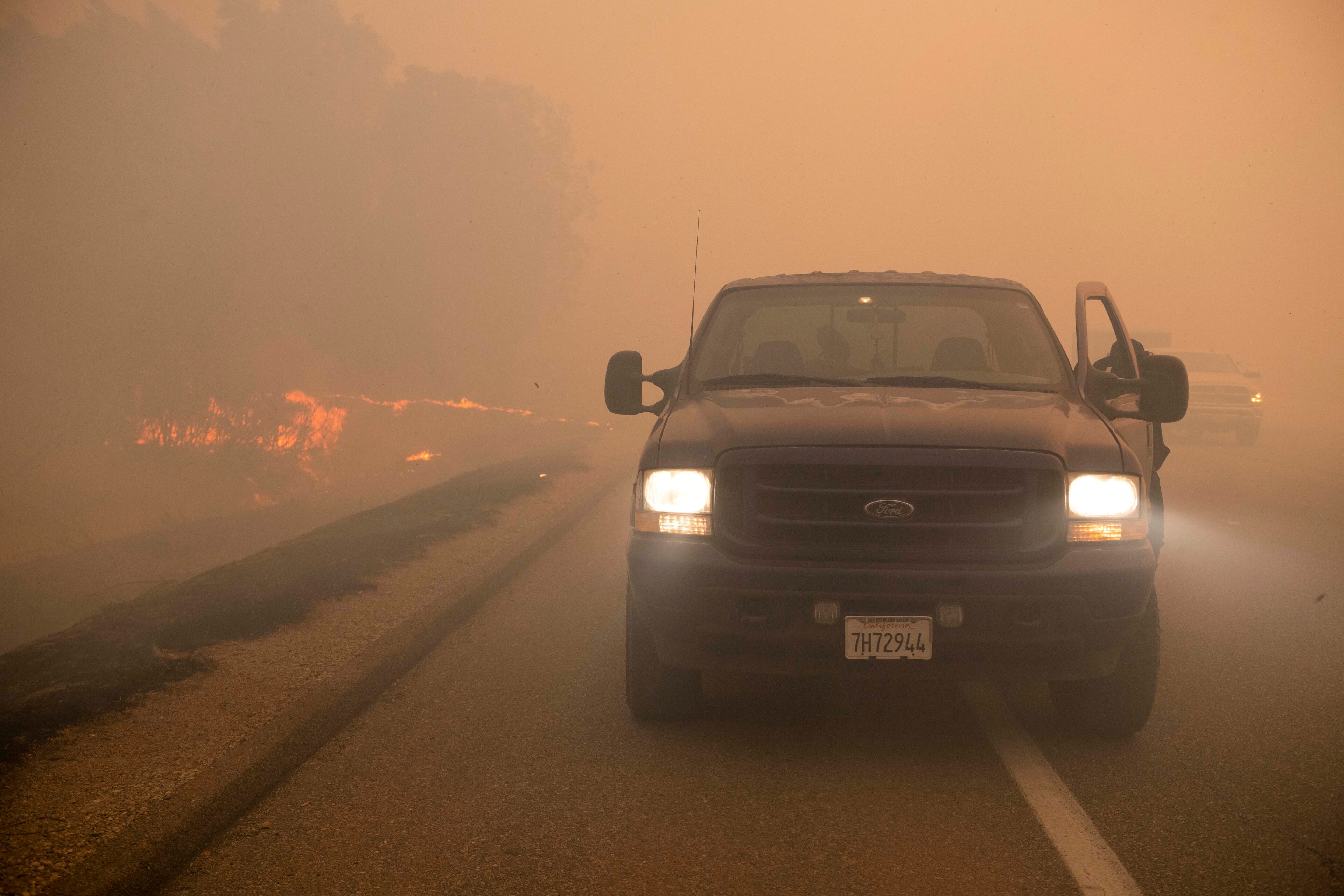 Smoke from wildfires burning in the region fills the air in Simi Valley, Calif., Wednesday, Oct. 30, 2019. A brush fire broke out just before dawn in the Simi Valley area north of Los Angeles. (AP Photo/Christian Monterrosa)