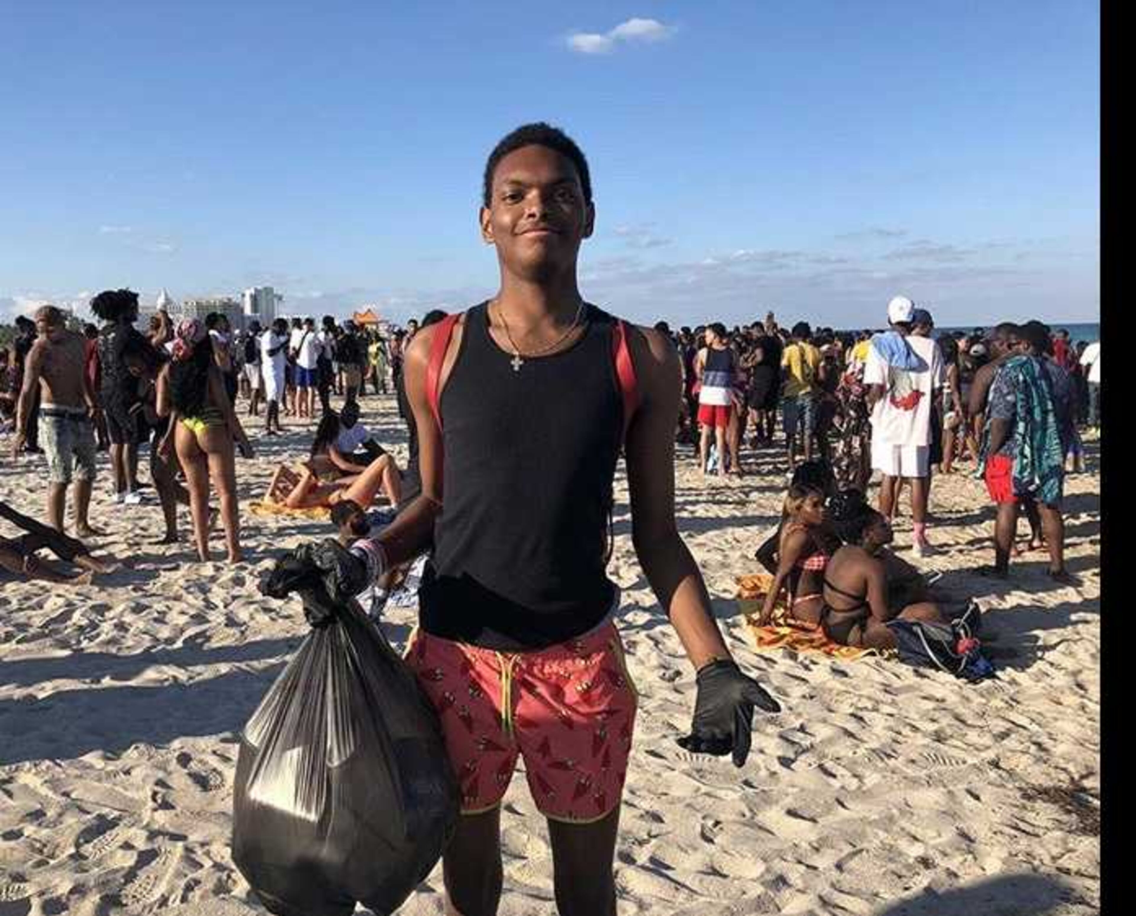 University of West Georgia student Joseph Caraway holds a bag of trash he picked up from people littering on Miami Beach. Caraway voluntarily picked up the trash during a Spring Break visit to the beach. Local officials lauded Caraway, 19, for his efforts. PHOTO CONTRIBUTED.
