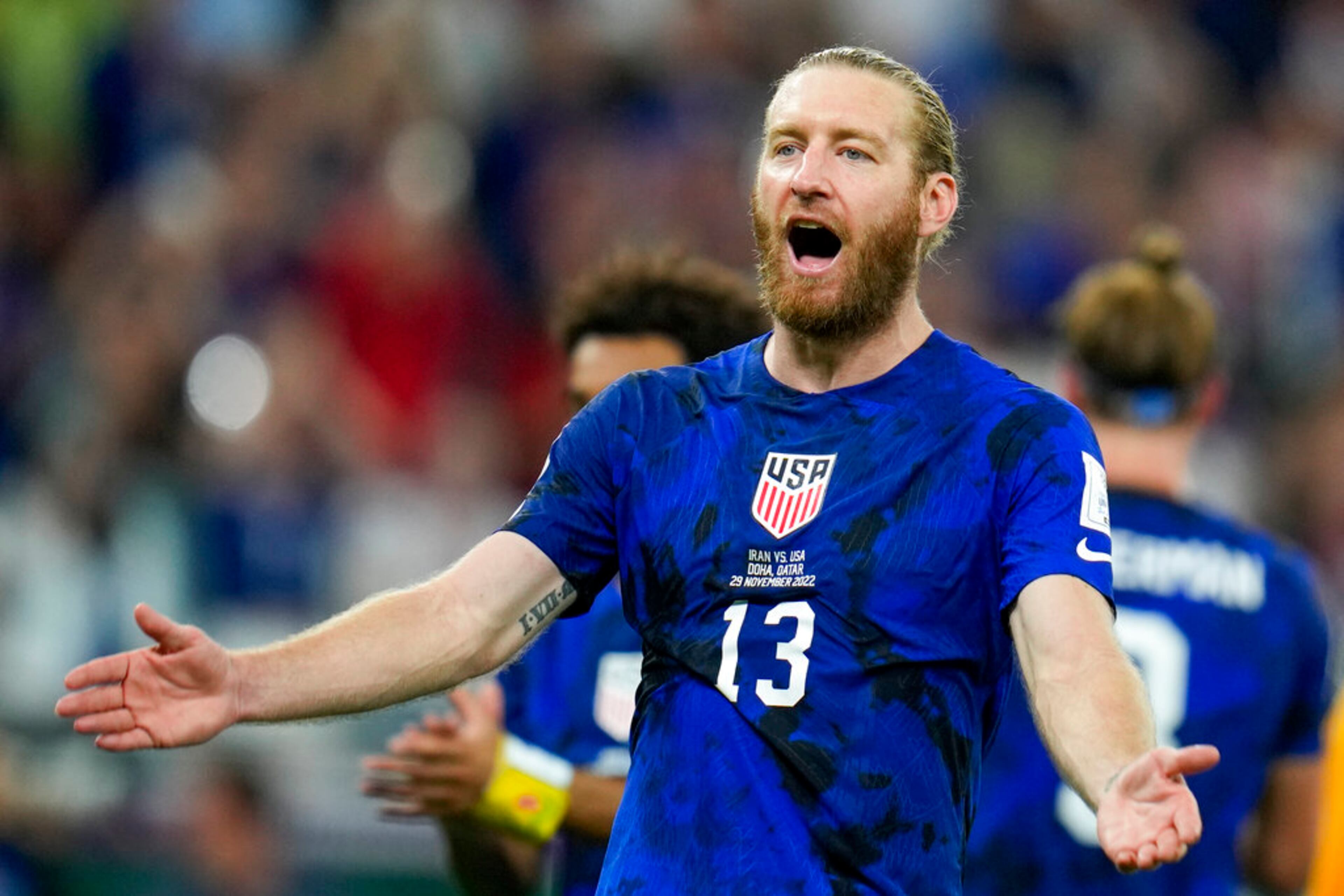 Tim Ream of the United States celebrates after the World Cup group B soccer match between Iran and the United States at the Al Thumama Stadium in Doha, Qatar, Wednesday, Nov. 30, 2022. (AP Photo/Ricardo Mazalan)