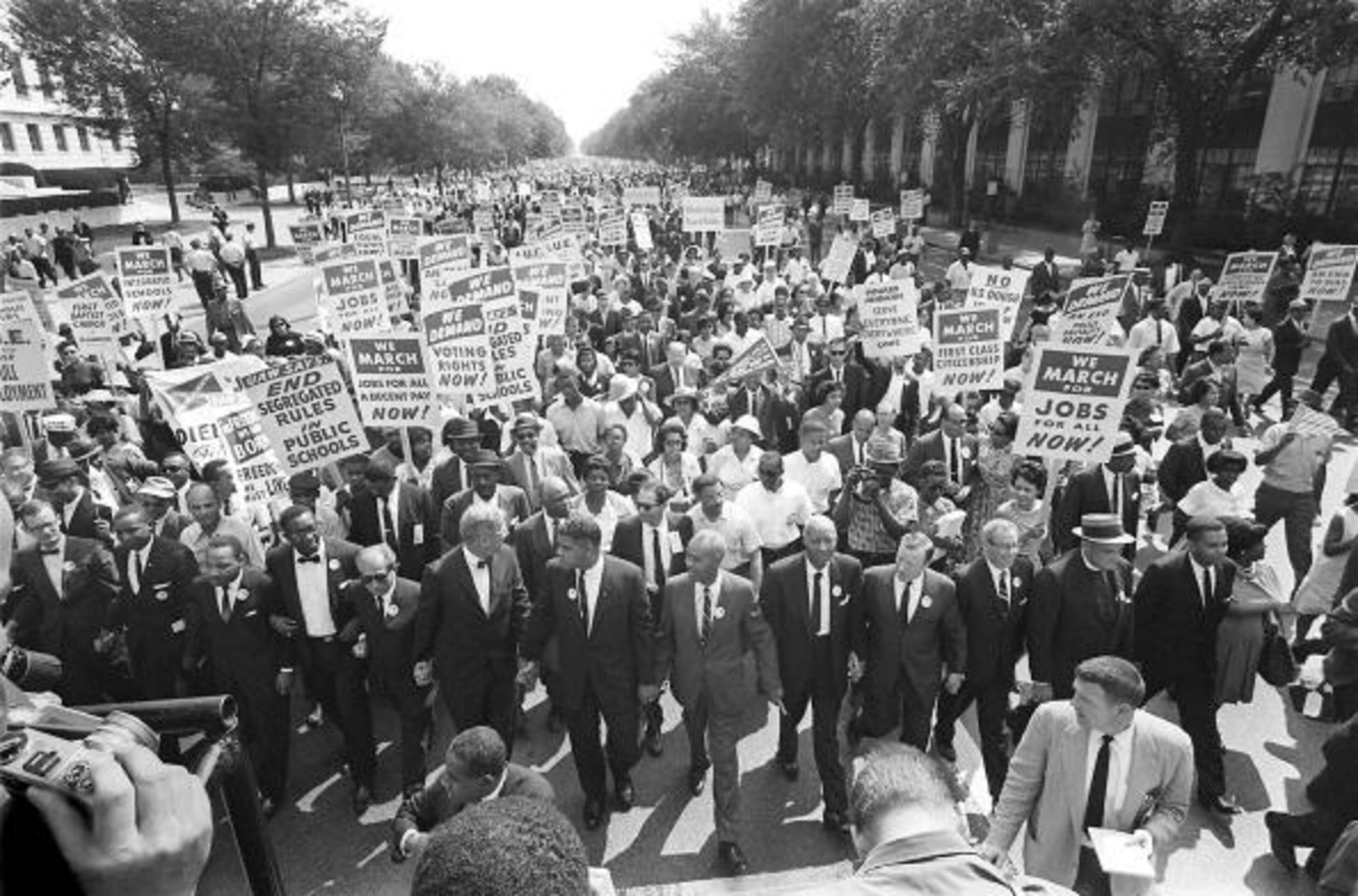 (FILES) US civil rights leader Martin Luther KIng (3rd from L) walks with supporters during the "March on Washington" 28 August, 1963 after which, King delivered the "I Have a Dream" speech from the steps of the LIncoln Memorial. 28 August, 2003 marks the 40th anniversary of the famous speech, which is credited with mobilizing supporters of desegregation and prompted the 1964 Civil Rights Act. King was assassinated on 04 April 1968 in Memphis, Tennessee. James Earl Ray confessed to shooting King and was sentenced to 99 years in prison. AFP PHOTO/FILES (Photo credit should read -/AFP/Getty Images)