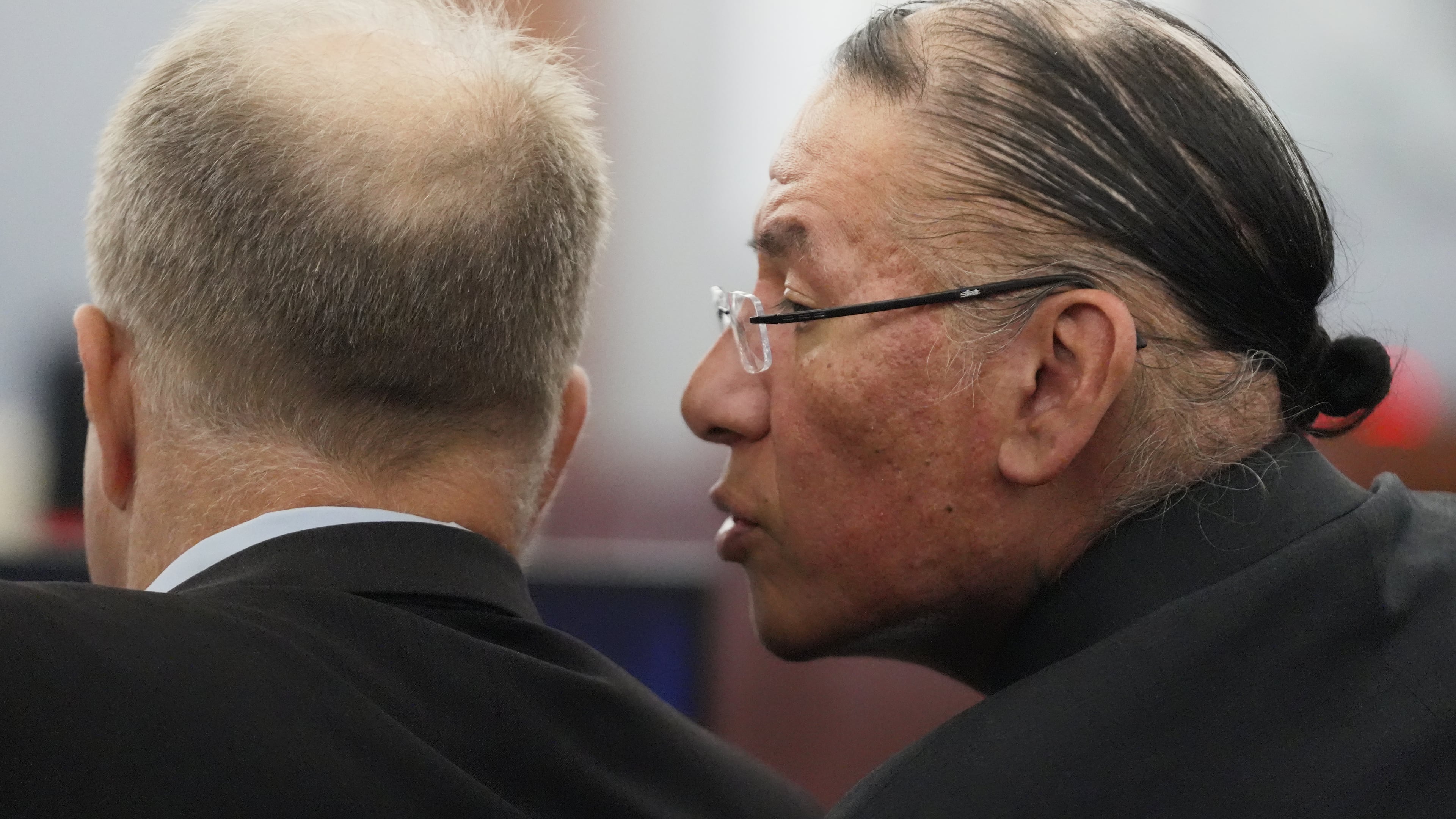 FILE - Nathan Chasing Horse, right, talks to his attorney Craig Mueller during his trial on charges of sexually abusing Indigenous women and girls, Jan. 13, 2026, in Las Vegas. (AP Photo/Ty ONeil, file)