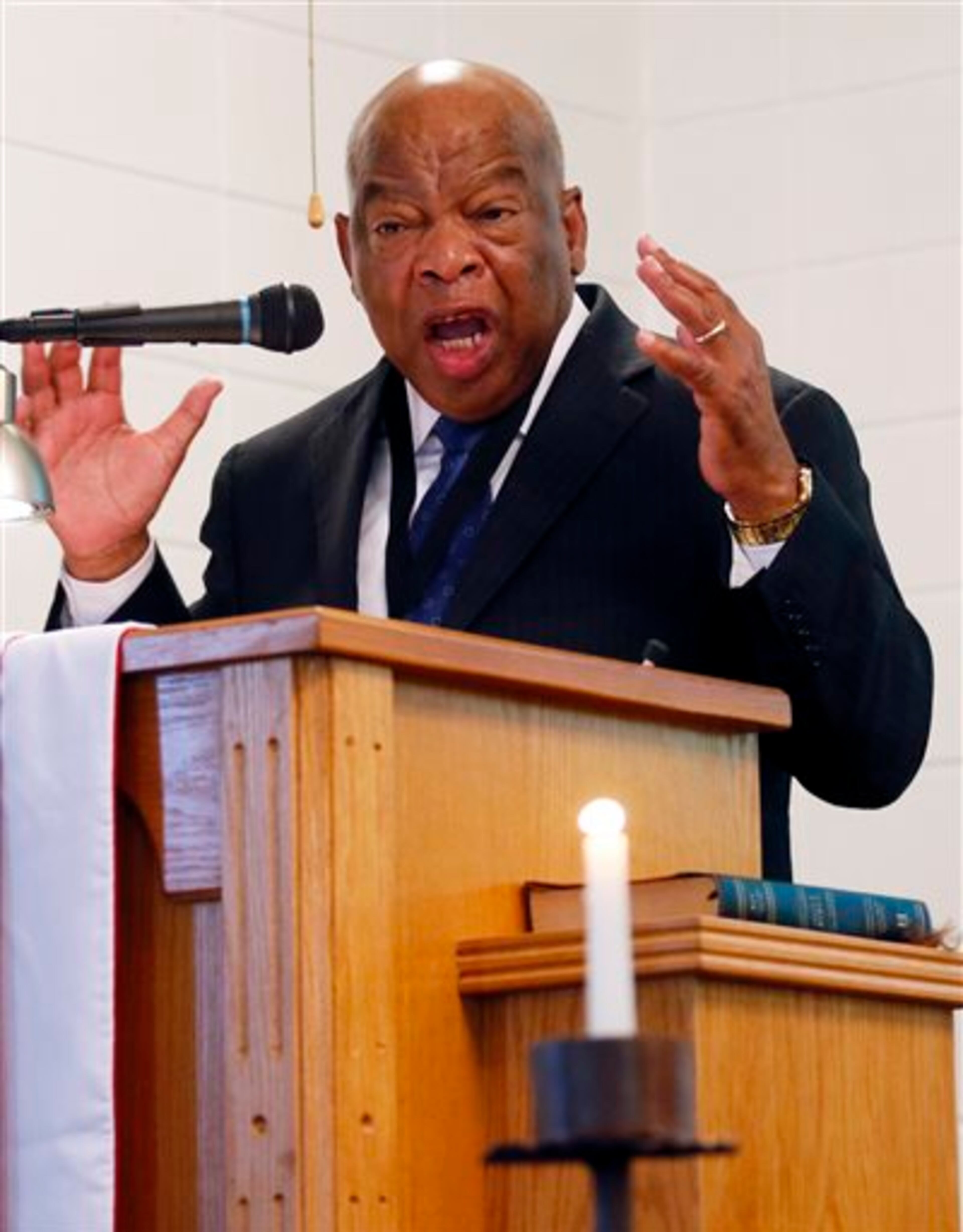 U.S. Rep. John Lewis, D-Ga., delivers the keynote address at the Mt. Zion United Methodist Church in Philadelphia, Miss., Sunday, June 15, 2014, during a commemorative service for three civil rights workers, James Chaney, Andrew Goodman, and Michael Schwerner, all killed in Neshoba County for their voter registration work among blacks in then segregationist Mississippi. (AP Photo/Rogelio V. Solis)