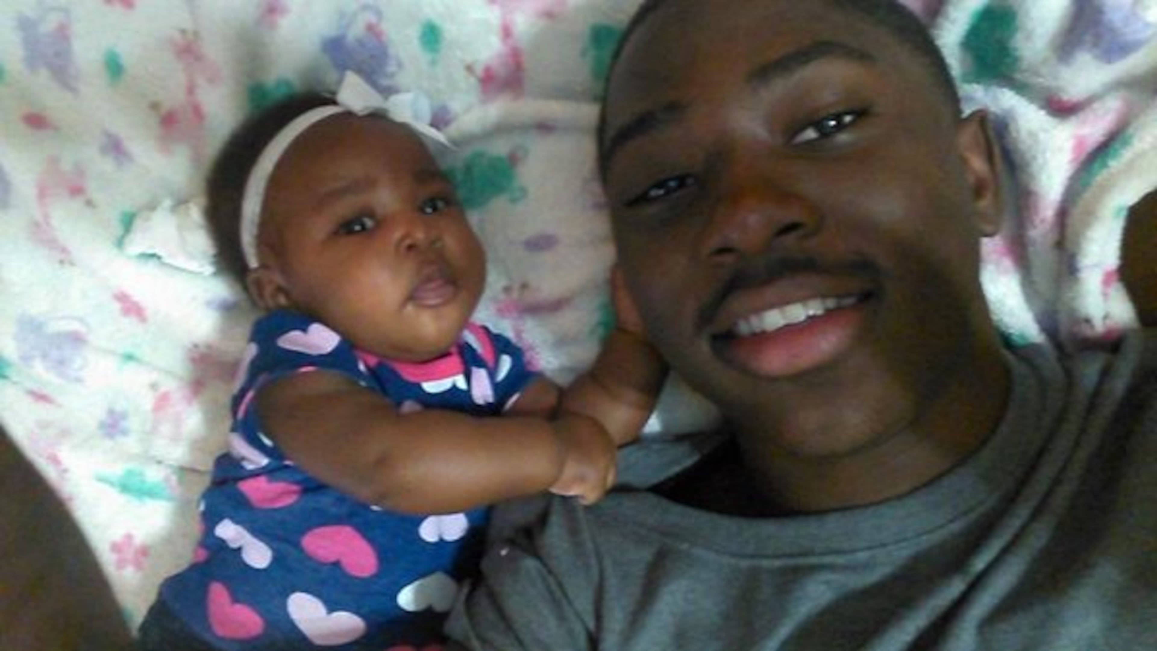 Cederrius Hastings, seen with his 8-month-old baby, was killed in a shooting Saturday morning in Jackson. (Credit: Channel 2 Action News)
