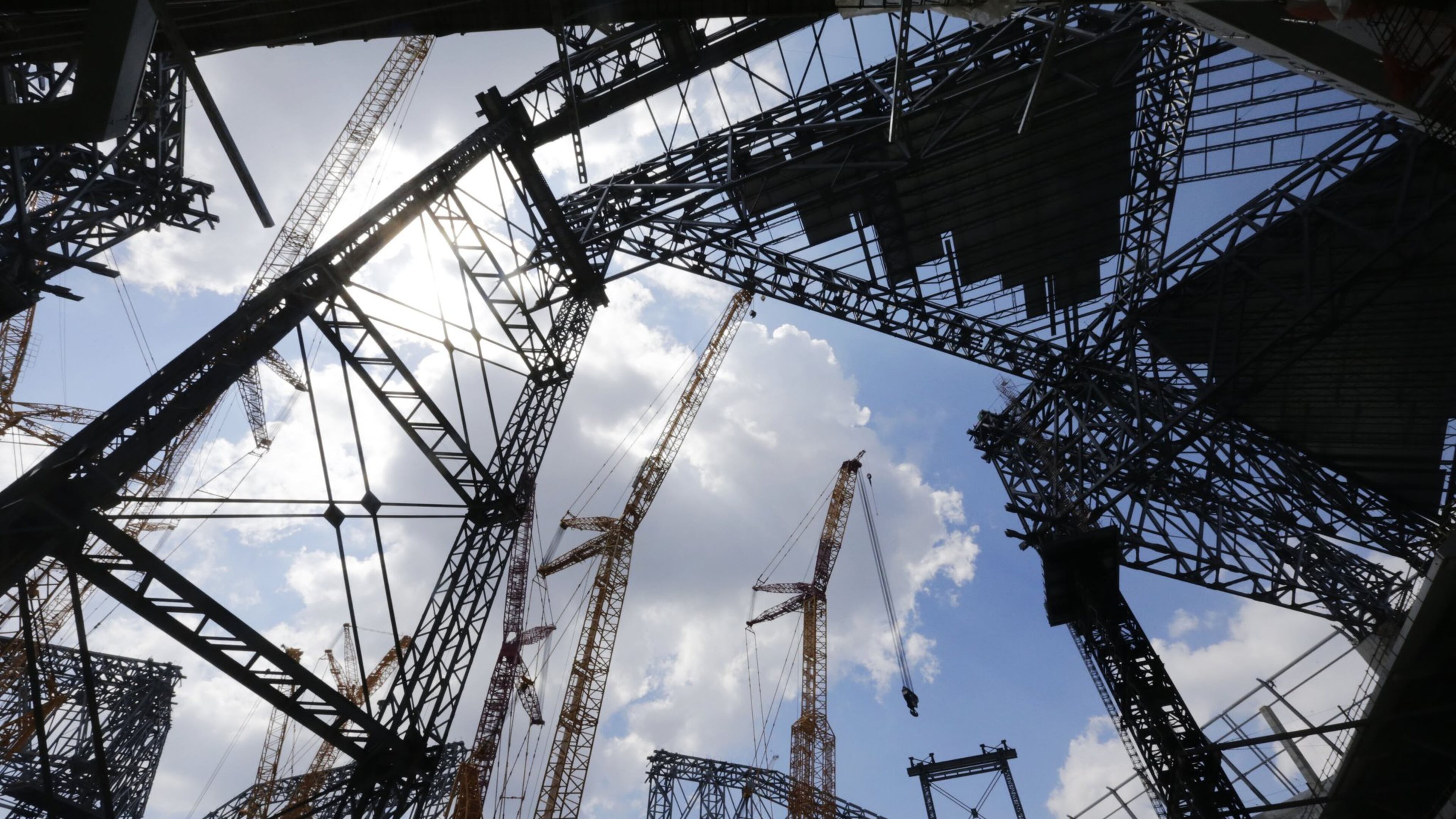 Looking up from field level during the media tour of Mercedes-Benz Stadium on June 23, this was the view of roof construction in progress. BOB ANDRES/BANDRES@AJC.COM