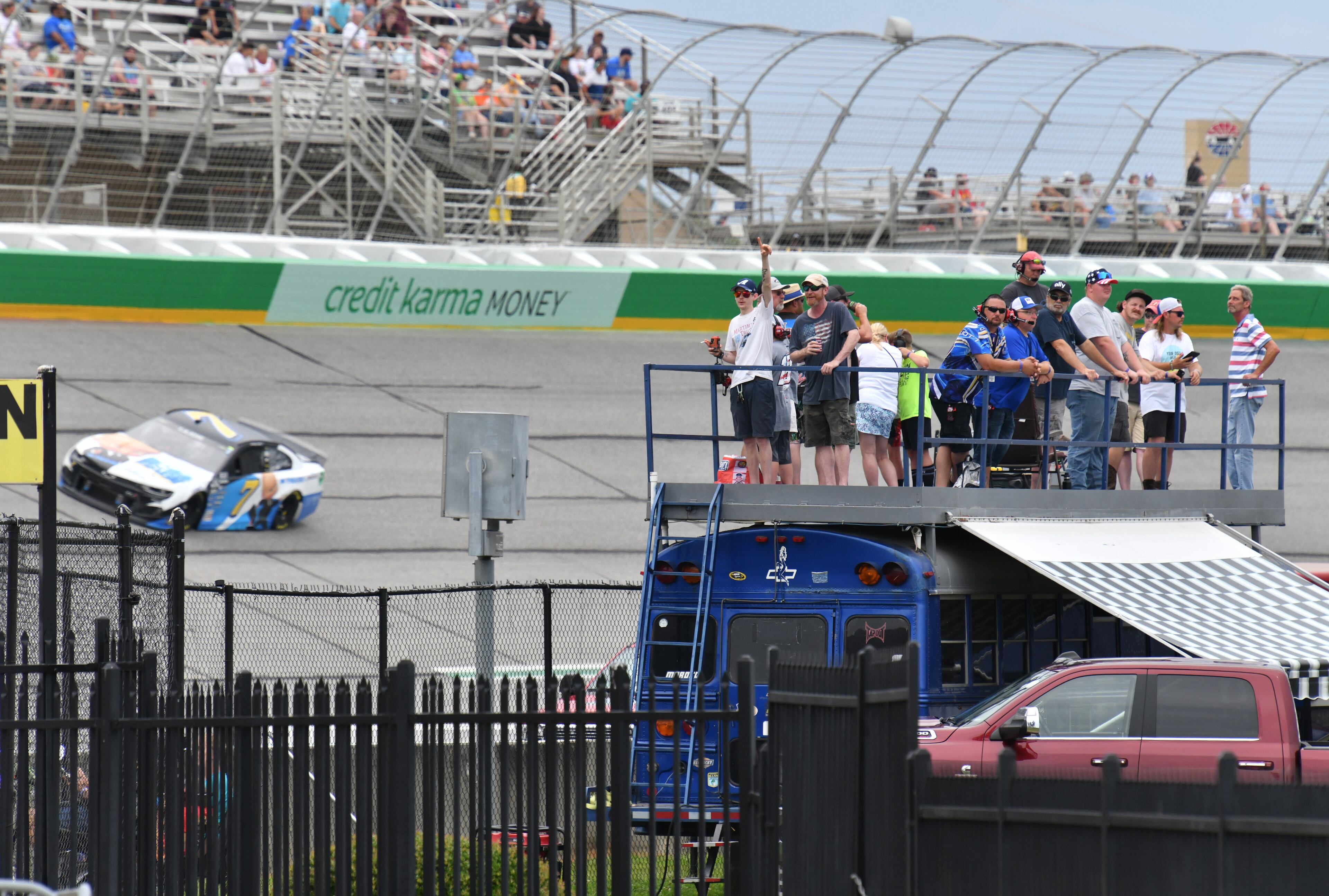 Fans cheer from the infield during the Quaker State 400 presented by Walmart Sunday, July 11, 2021, at Atlanta Motor Speedway in Hampton. (Hyosub Shin / Hyosub.Shin@ajc.com)
