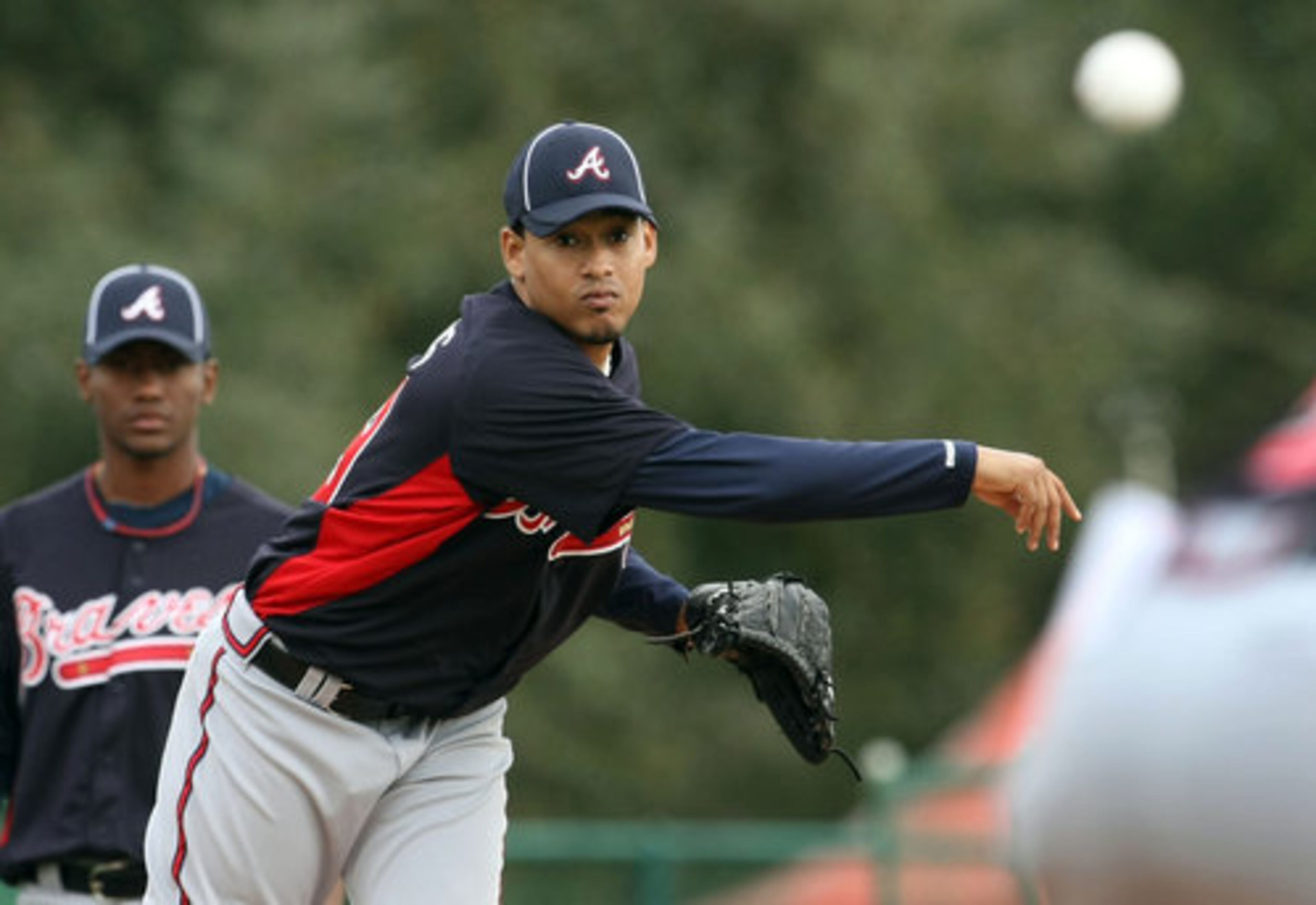 Atlanta Braves pitcher Jair Jurrjens practices his pickoff move to first base