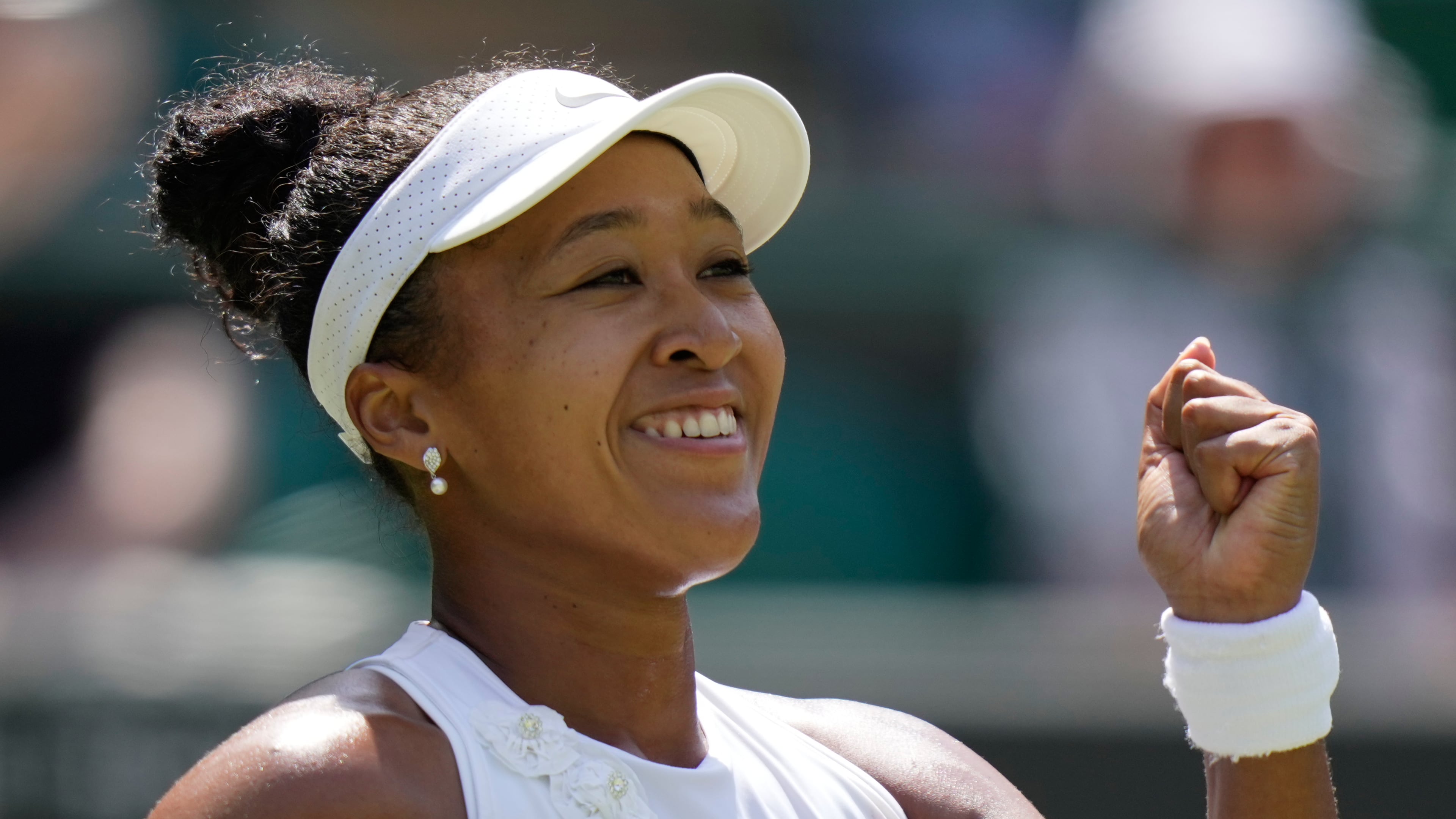 Naomi Osaka of Japan celebrates winning the third round women's singles match against Daria Kasatkina of Australia at the Wimbledon Tennis Championships in London, Friday, July 3, 2026.(AP Photo/Brian Inganga)