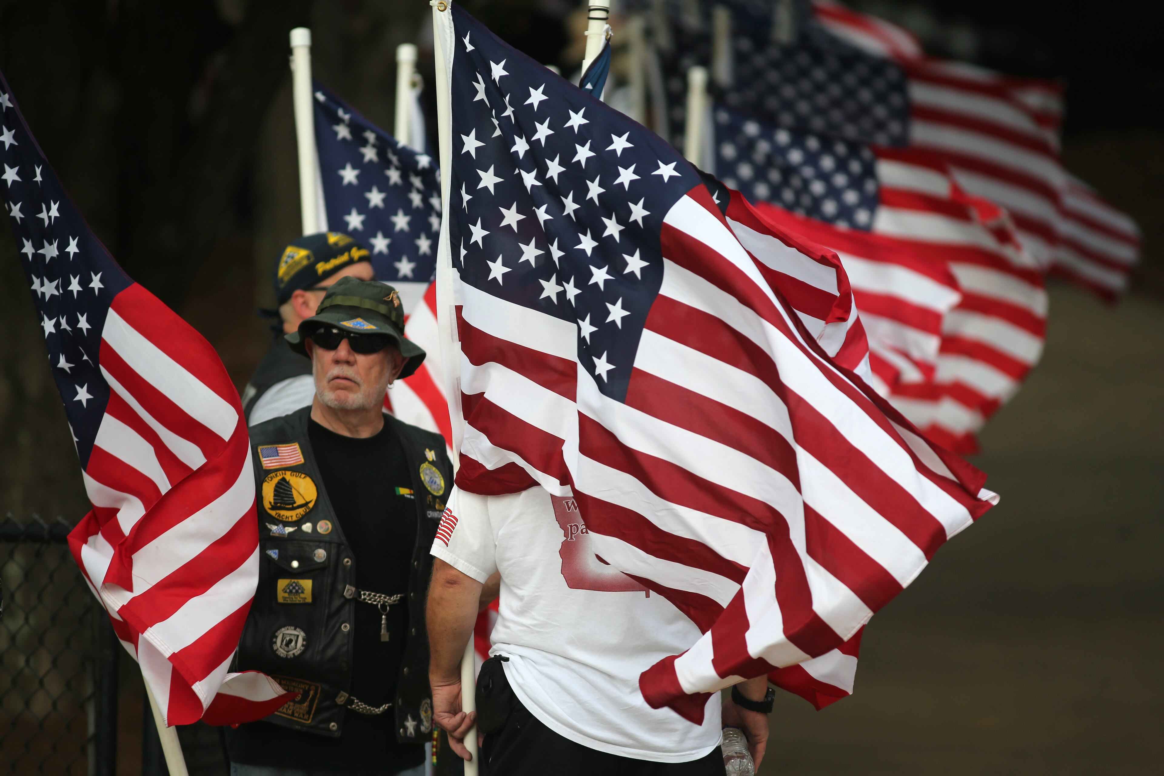 Jerry Green stands in the flag line of the Patriot Guard Riders before the beginning of the memorial service for Skip Wells Tuesday evening July21, 2015 at Sprayberry High School. Wells was one of the Marines killed in Chattanooga. Ben Gray / bgray@ajc.com