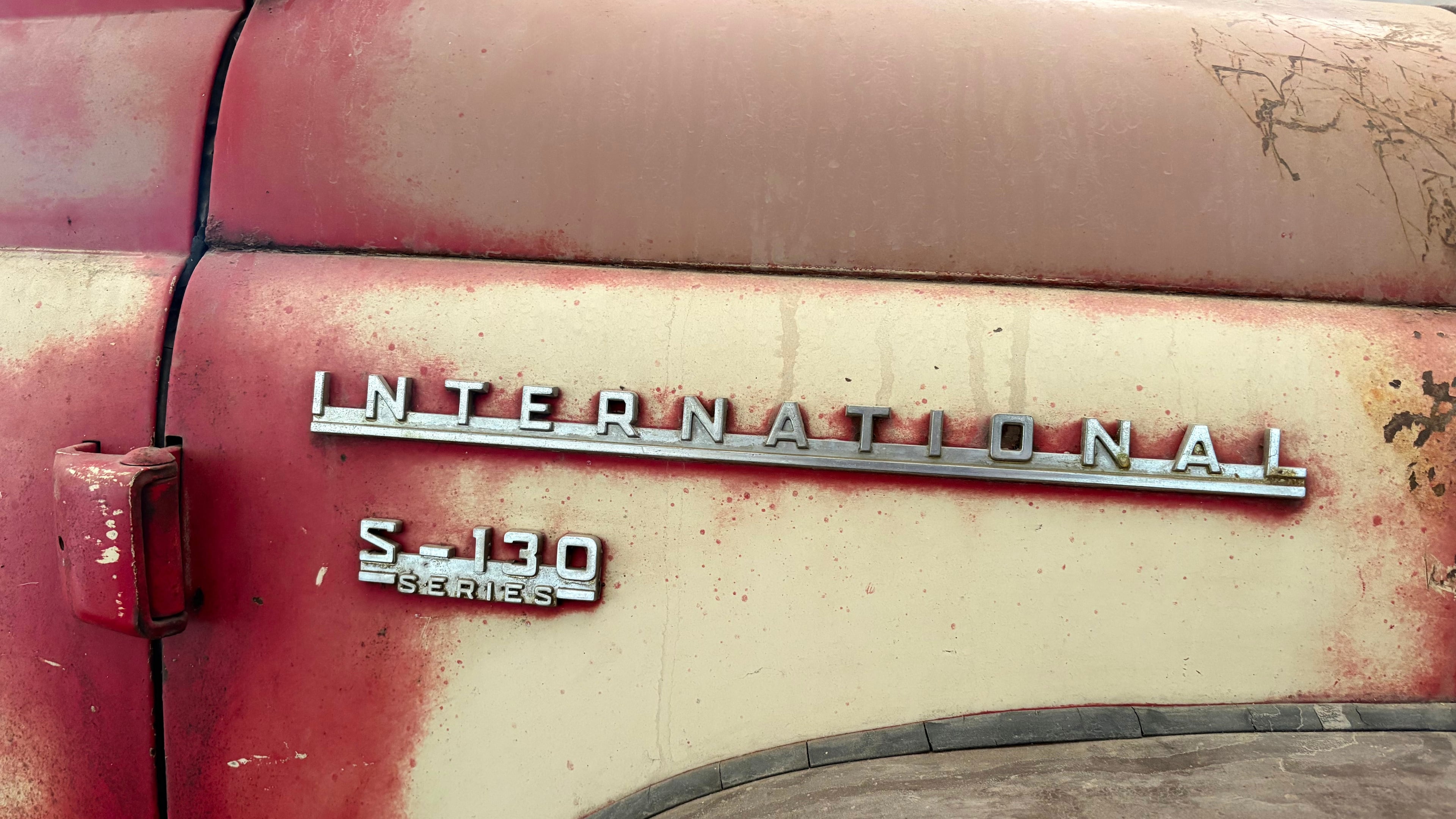The make and series are displayed on the side of a 1956 International Harvester S-130 pickup truck in Mason, Ill., Sunday, May 24, 2026. (AP Photo/Holly Meyer)