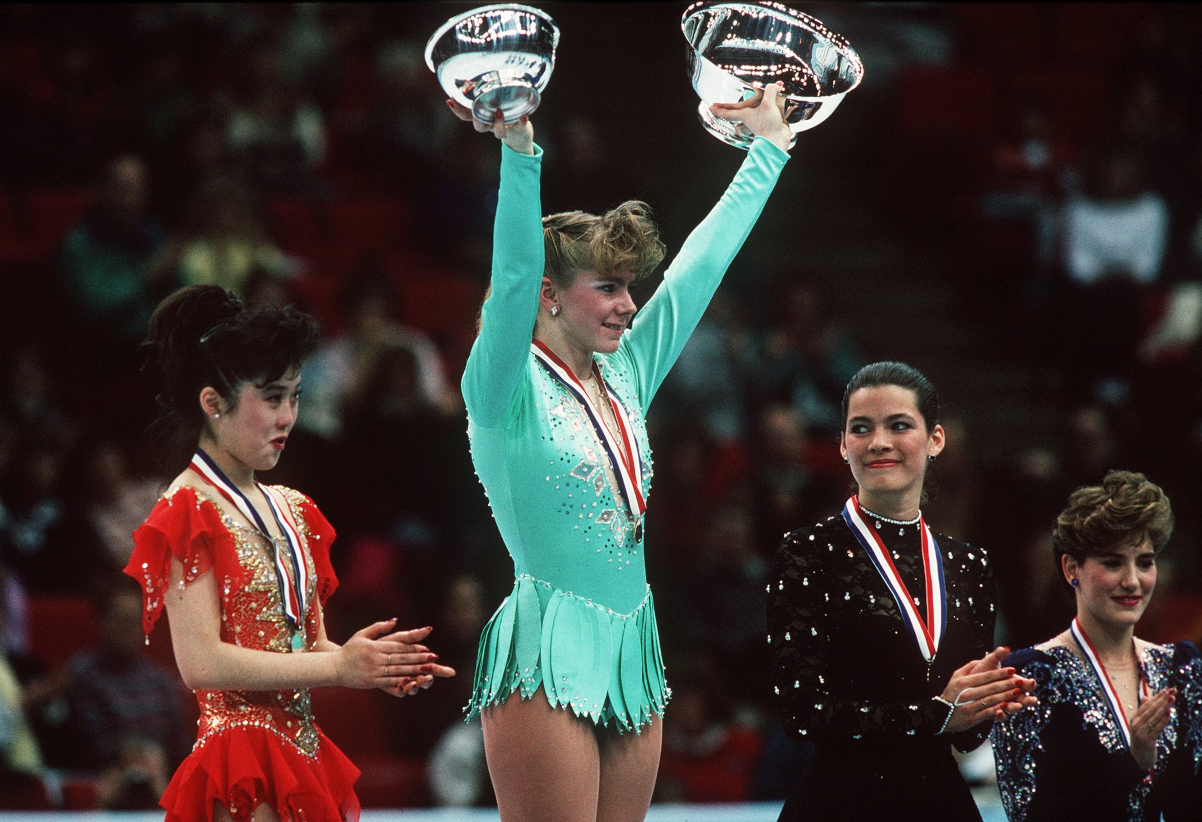 From left: Kristi Yamaguchi, Tonya Harding and Nancy Kerrigan on the podium at the 1991 U.S. Figure Skating Championships. (Tim Defrisco/ALLSPORT)