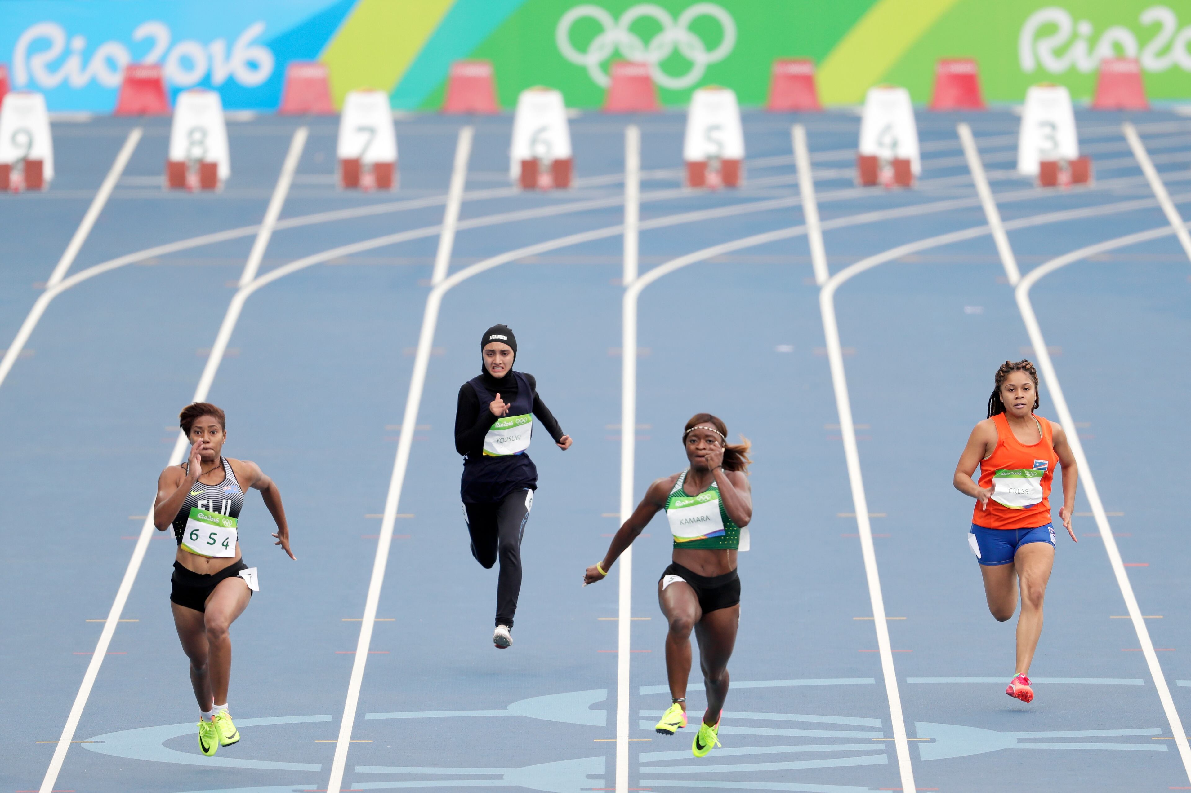RIO DE JANEIRO, BRAZIL - AUGUST 12: Athleetes compete in the Women's 100 metres preliminary heats on Day 7 of the Rio 2016 Olympic Games at the Olympic Stadium on August 12, 2016 in Rio de Janeiro, Brazil. (Photo by Jamie Squire/Getty Images)