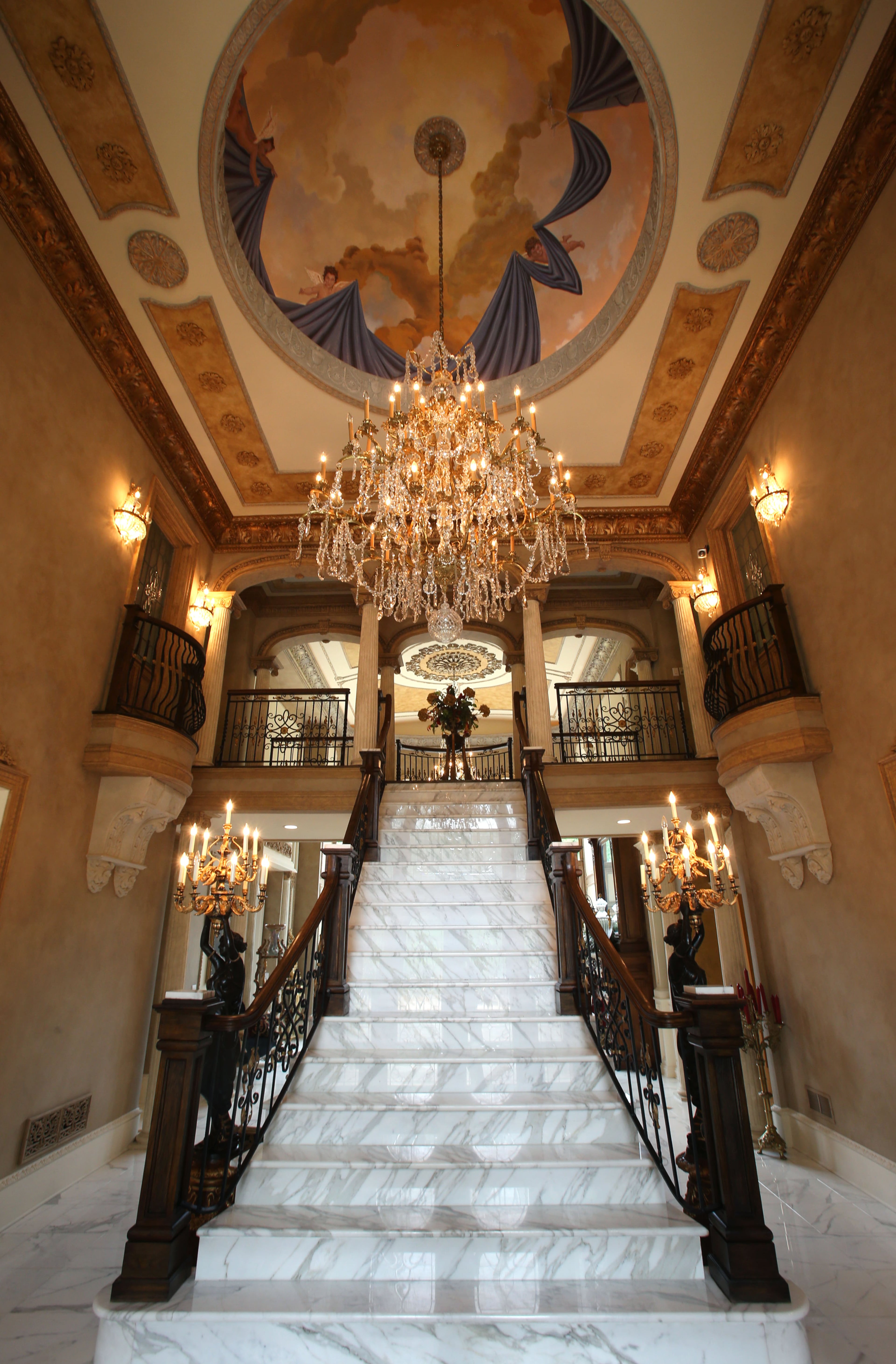 The main staircase is shown at the front entrance to the home of Scott and Livia Hostetler. The Hostetler bought this house in 2011 and put in incredible gardens in the front and back. Now it's becoming imaginary settings for TV shows and movies. Queen Latifah had a scene walking down the main staircase in an episode of "Single Ladies."