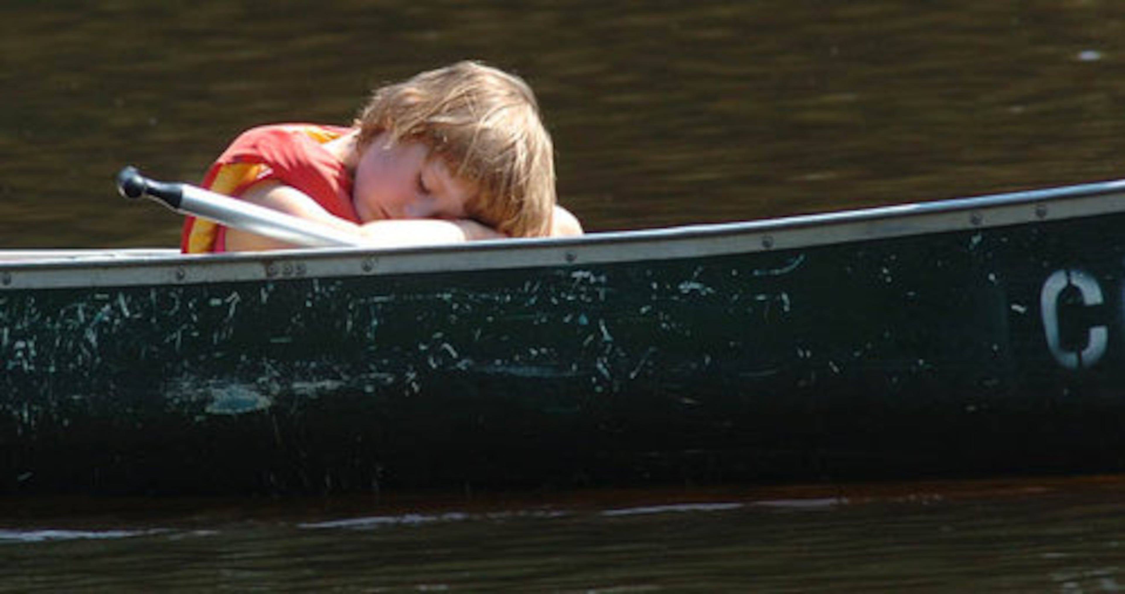 Casey Holbrook, 5, of Jefferson, appears to be in the mood for a nap near the end of the session. Grandmaother Rita Holbrook was doing the paddling.
