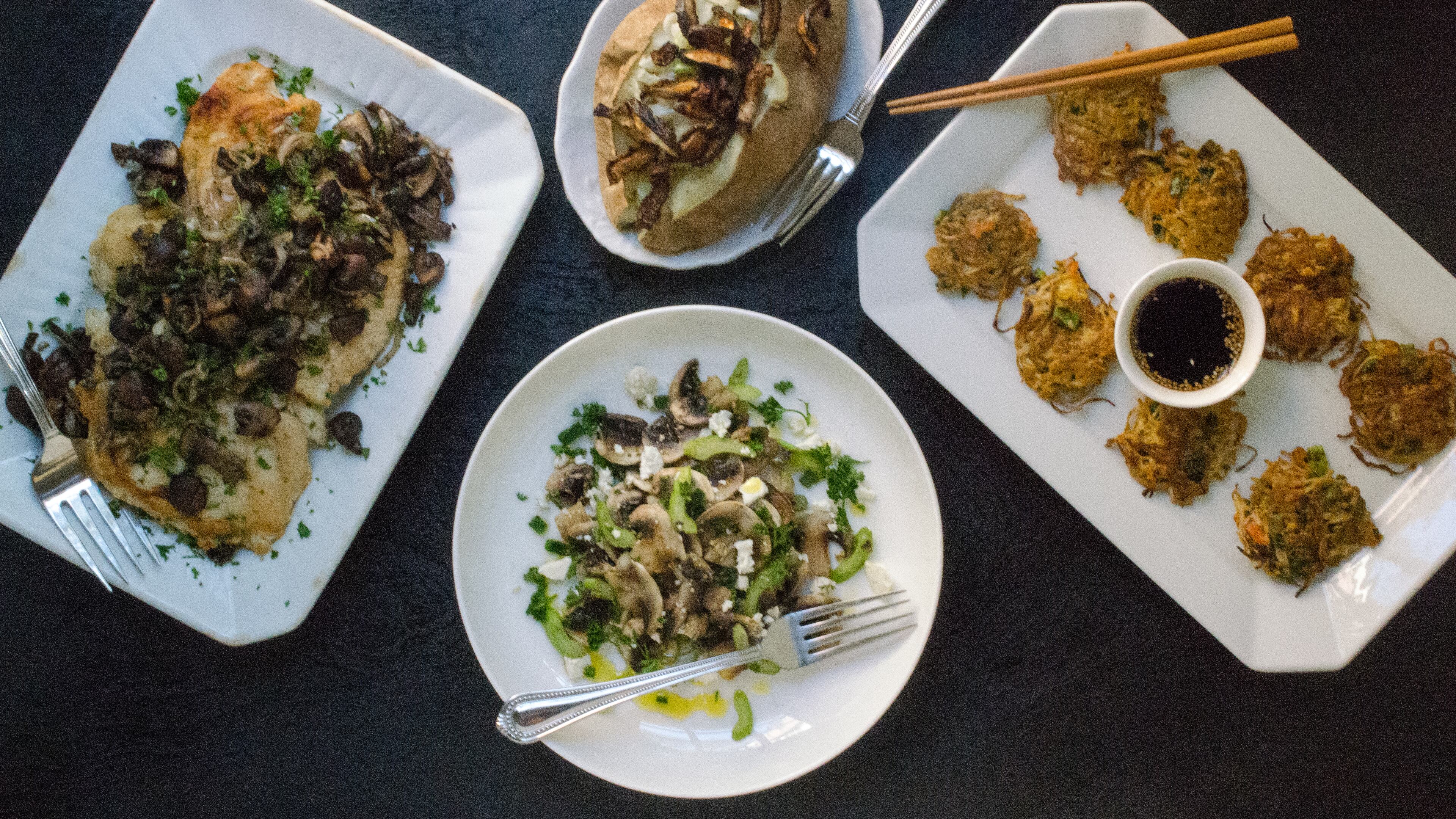 Mushrooms can be the centerpiece in salads, appetizers and entrees. Pictured (clockwise from left) are Chicken Paillard with Sauteed Mushrooms, Loaded Baked Potato with Shiitake "Bacon," Enoki Mushroom Fritters, and Mushroom and Celery Salad. (Virginia Willis for The Atlanta Journal-Constitution)