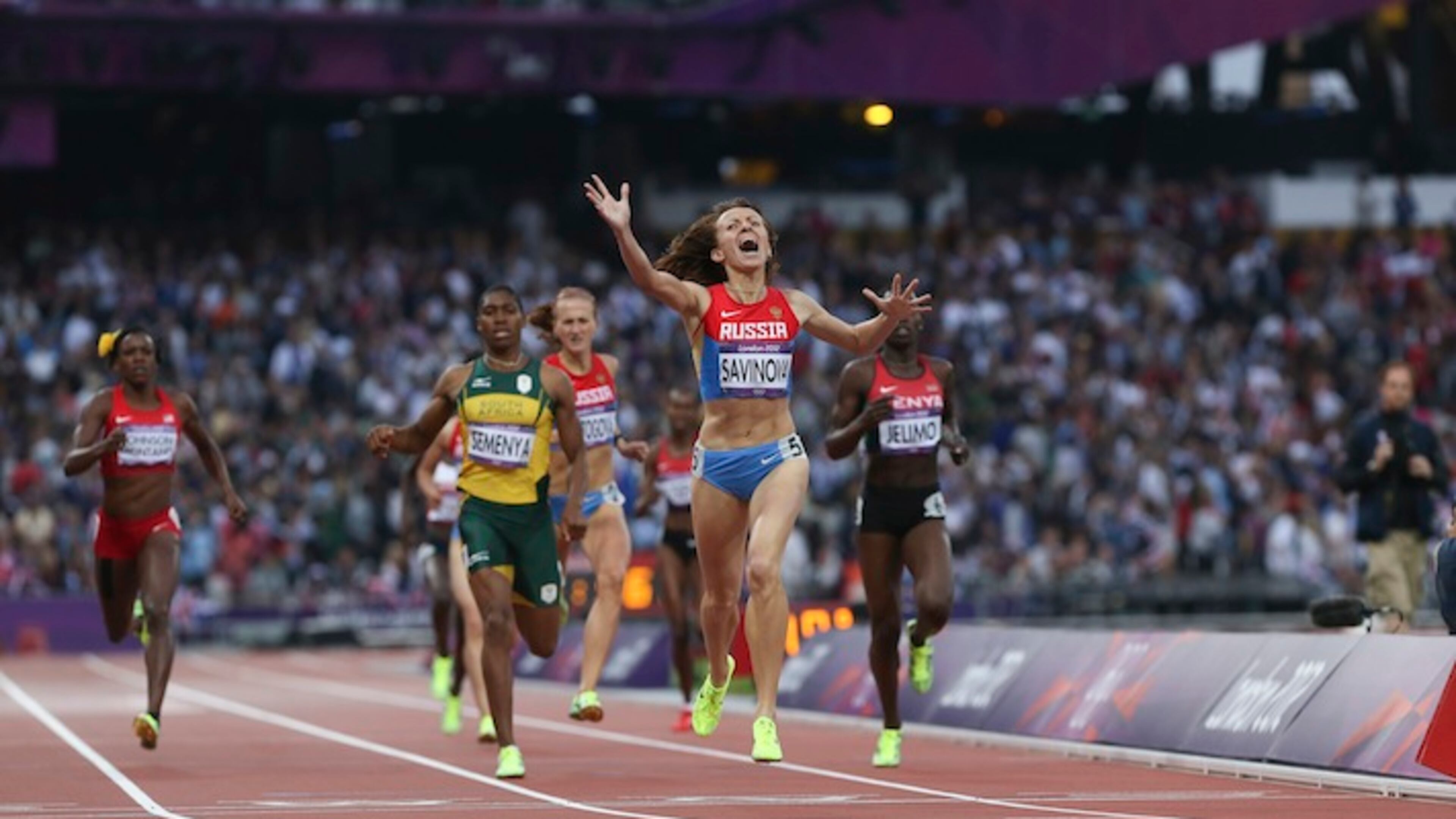 FILE — Mariya Savinova, of Russia, wins gold in the women’s 800 meter during the 2012 Summer Olympics with Alysia Montano, of the U.S., left, an American 800-meter runner who finished fifth, in London, Aug. 11, 2012. The World Anti-Doping Agency released the findings of its extraordinary inquiry into doping and corruption in Russian track and field, recommending Russia be suspended from track and field competition, including next year’s Olympics in Rio de Janeiro. (Josh Haner/The New York Times)
