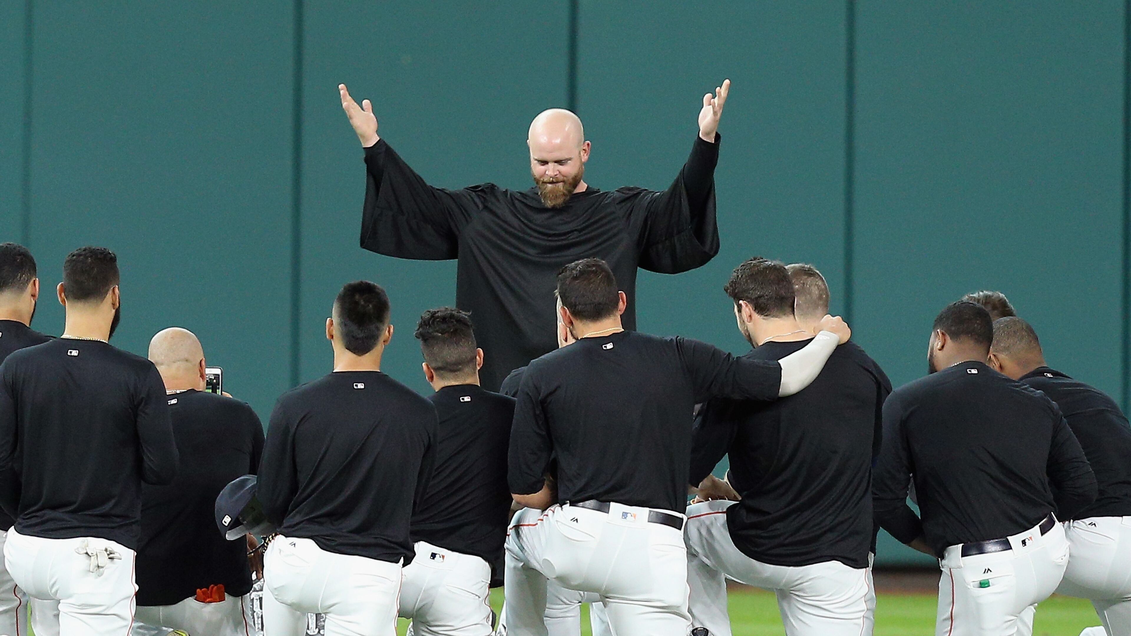 Astros catcher Brian McCann gives the eulogy for Carlos Beltran's glove in center field at Minute Maid Park on July 17, 2017 in Houston, Texas. Beltran has not played outfield since May 16.