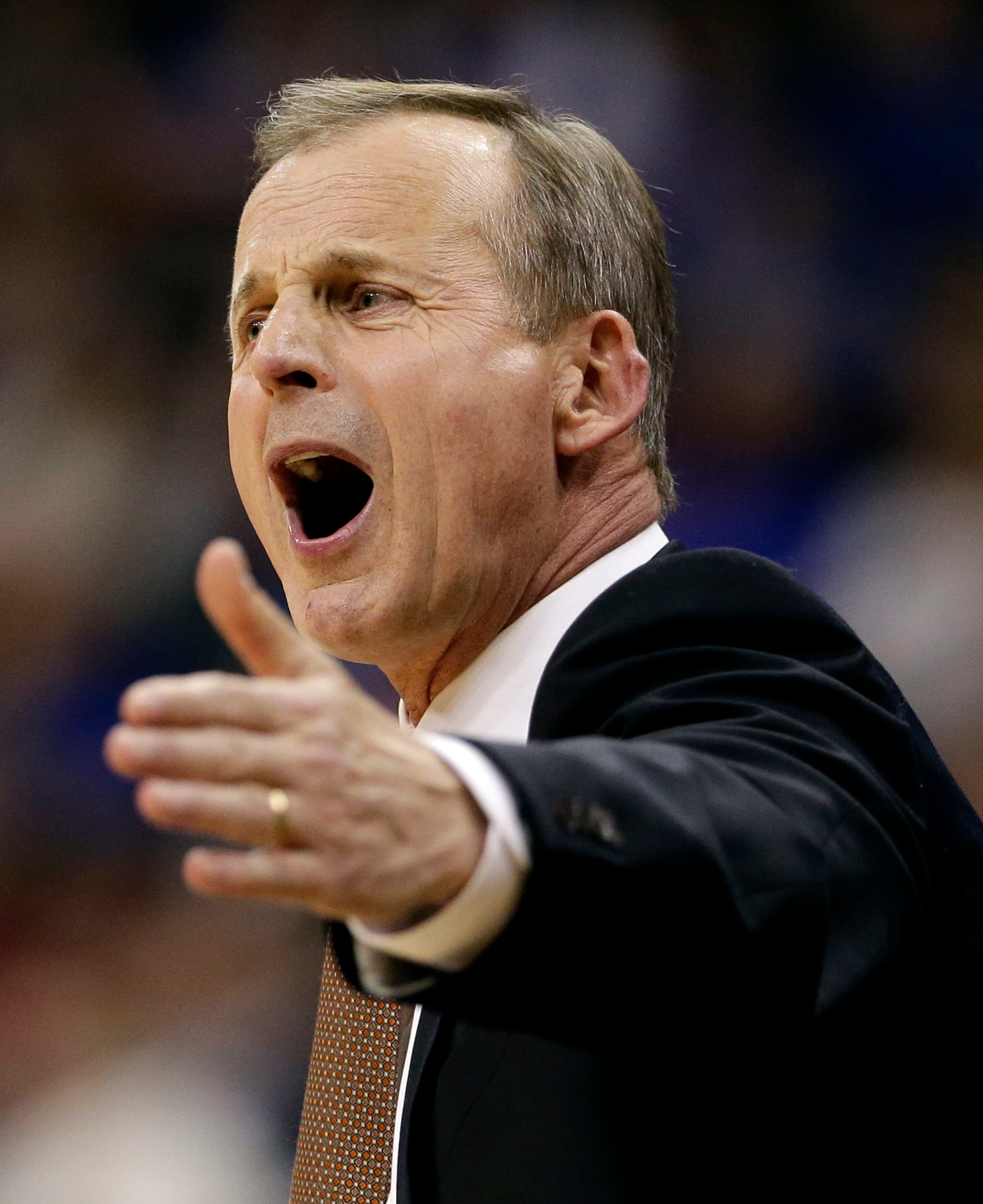 Texas coach Rick Barnes questions a call during the first half of an NCAA college basketball game against Baylor in the semifinals of the Big 12 Conference tournament on Friday, March 14, 2014, in Kansas City, Mo.