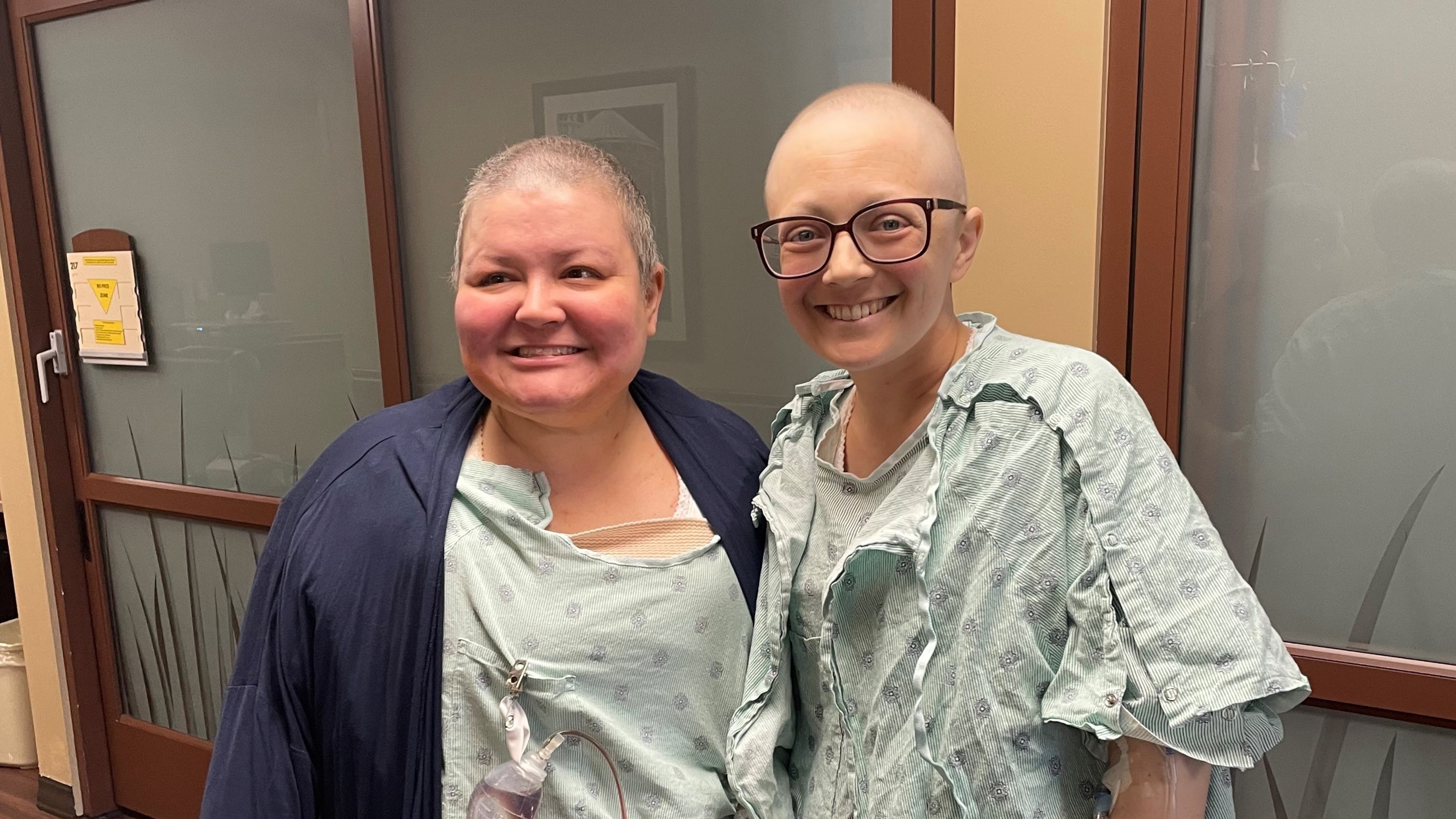 Brittney Powell (left) and Lauren Norris hug after undergoing breast cancer surgeries at City of Hope Cancer Center Atlanta in Newnan. (Courtesy of Brittney Powell and Lauren Norris)
