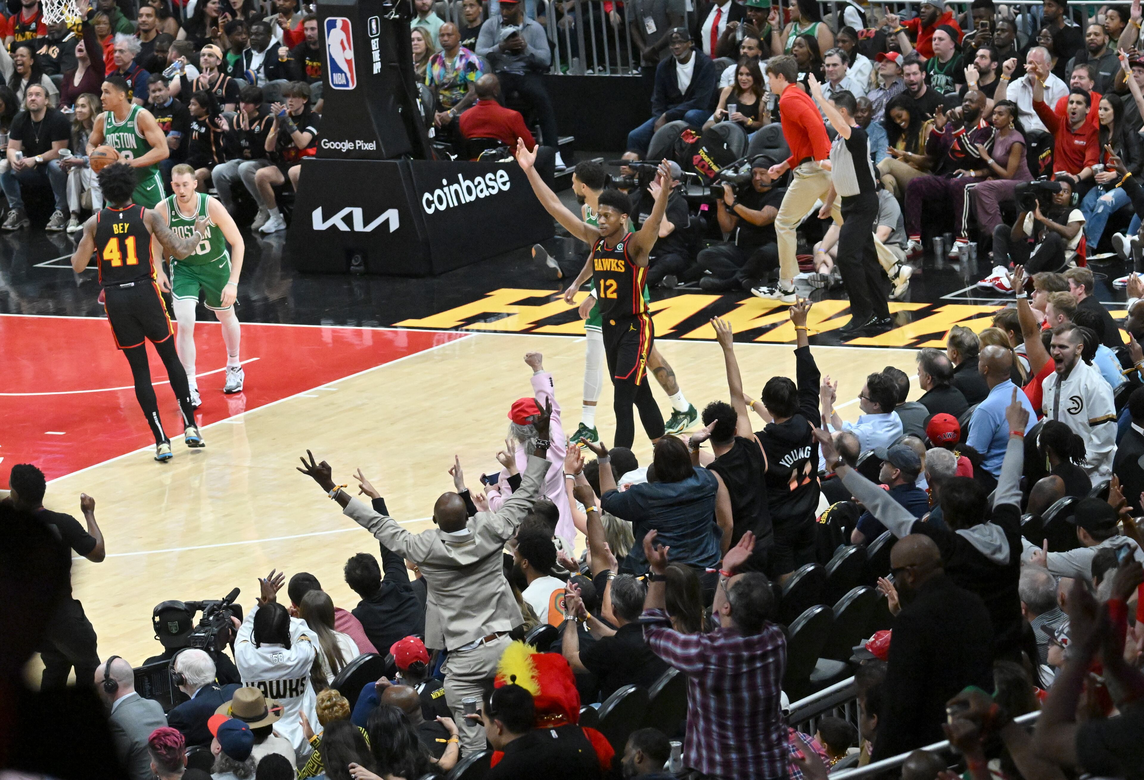 Atlanta Hawks' forward De'Andre Hunter (12) reacts after scoring during the second half in Game 3. (Hyosub Shin / Hyosub.Shin@ajc.com)