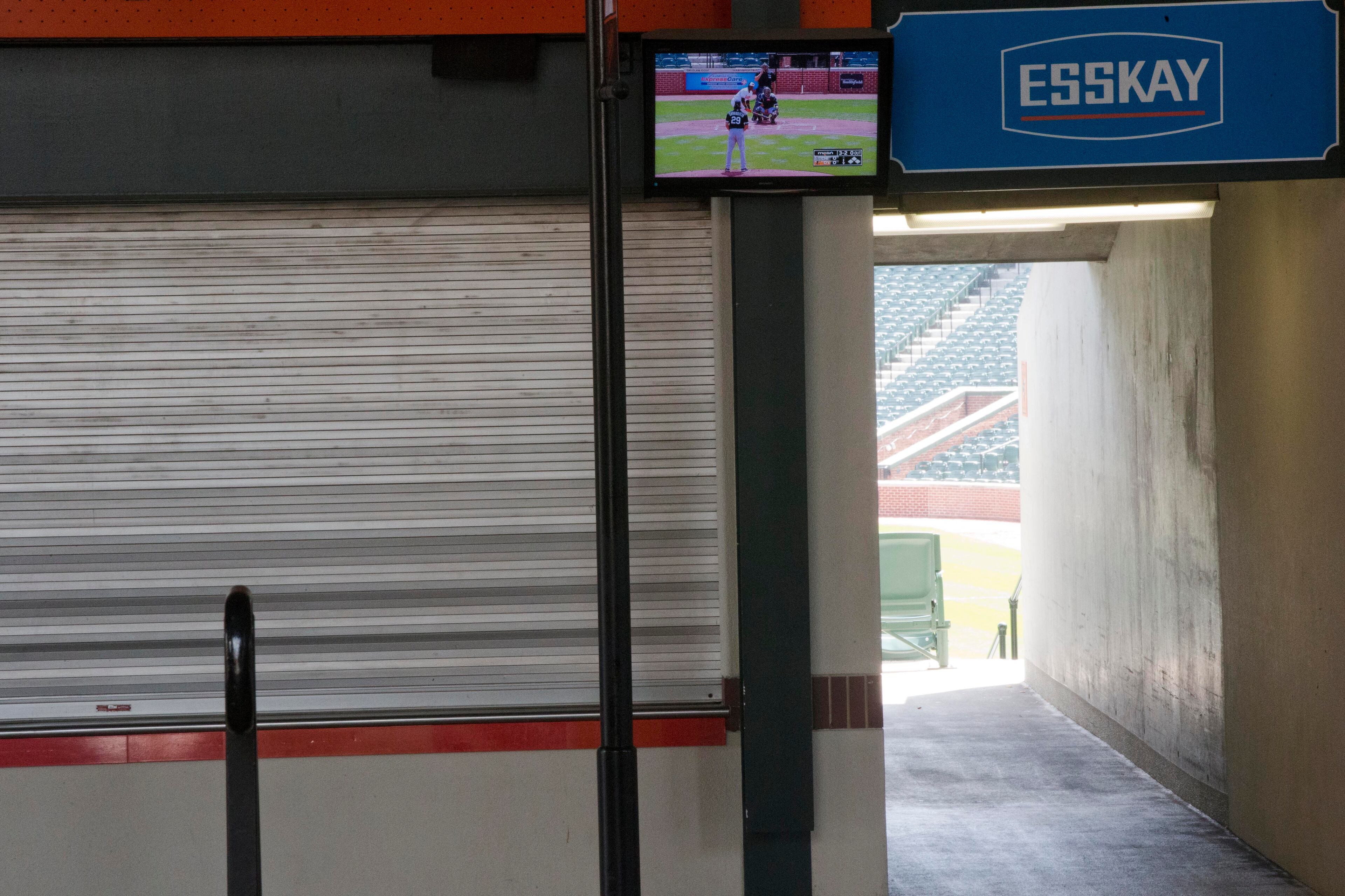A TV plays the Baltimore Orioles baseball game against the Chicago White Sox's, Wednesday, April 29, 2015, seen from out side of Camden Yards in Baltimore. The game was played in an empty Oriole Park at Camden Yards amid unrest in Baltimore over the death of Freddie Gray while in police custody. (AP Photo/Matt Rourke)