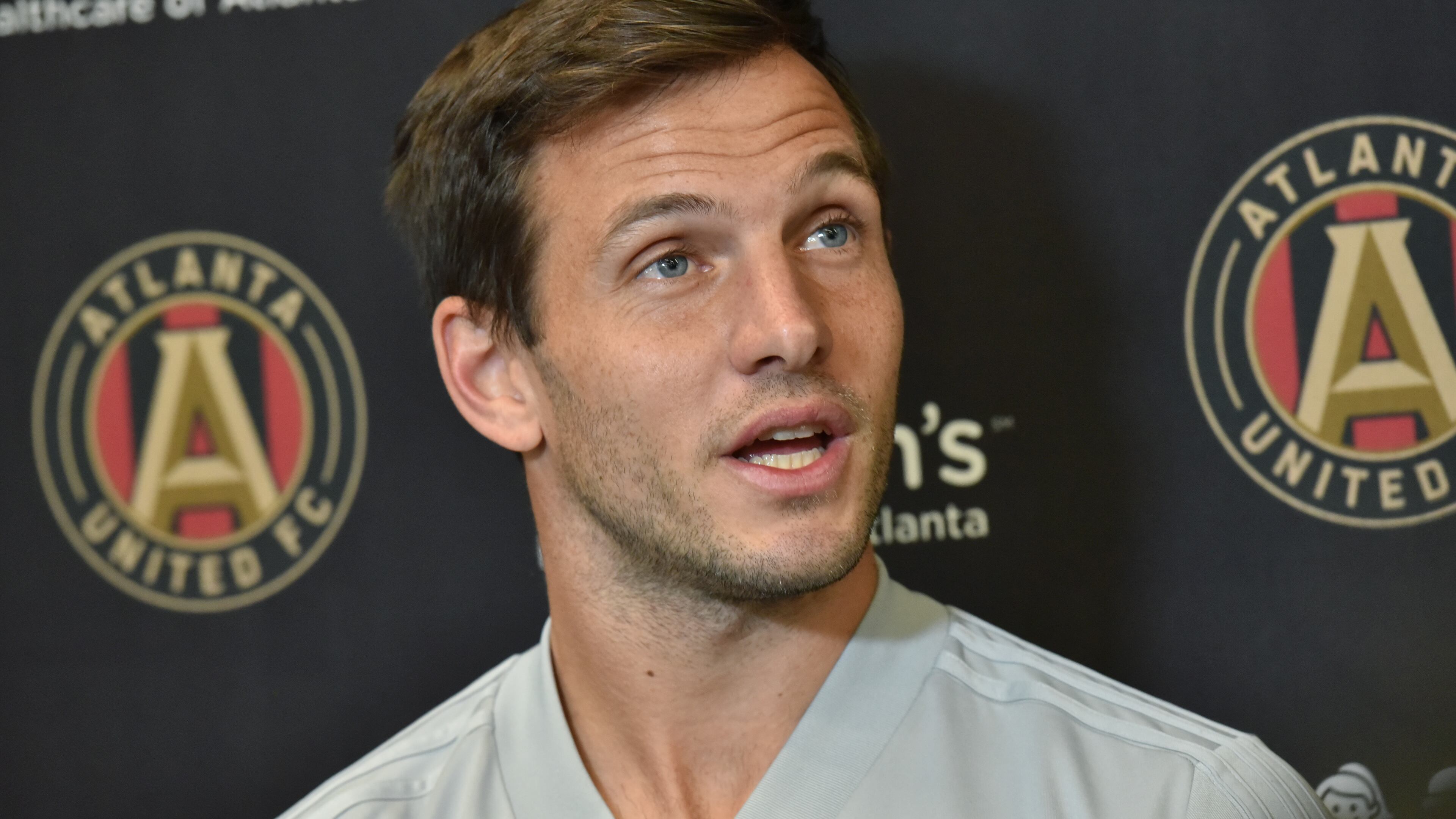 Midfielder Kevin Kratz (32) speaks to members of the press before Tuesday's practice at Children's Healthcare of Atlanta Training Ground in Marietta. (Hyosub Shin/hshin@ajc.com)