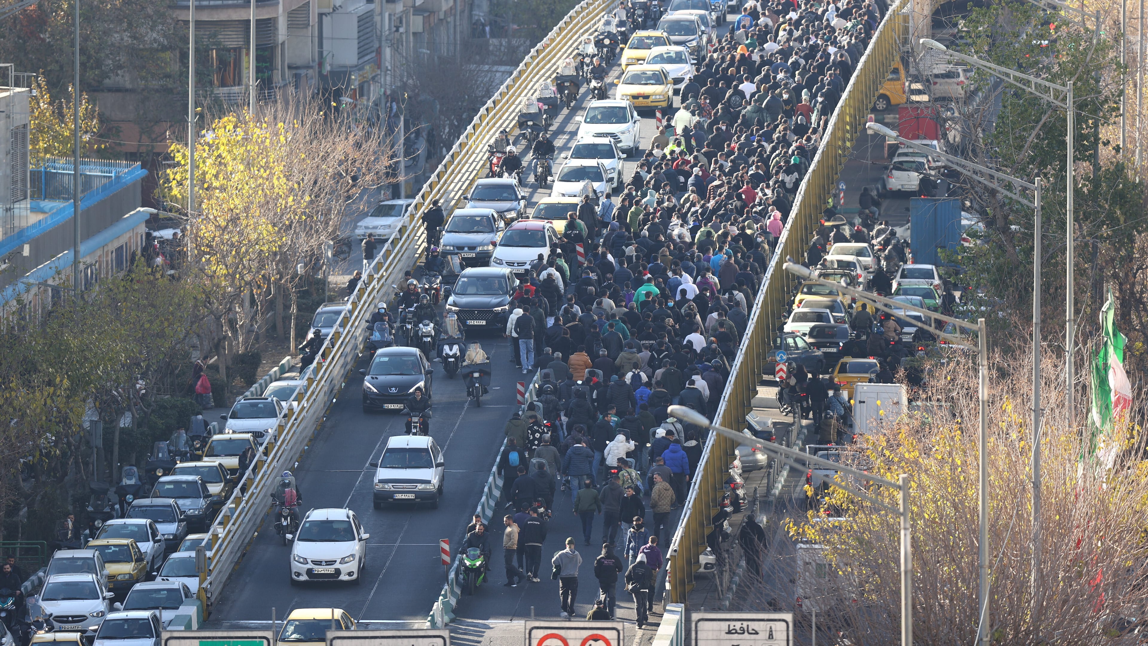FILE - Protesters march on a bridge in Tehran, Iran, on Dec. 29, 2025. (Fars News Agency via AP, File)