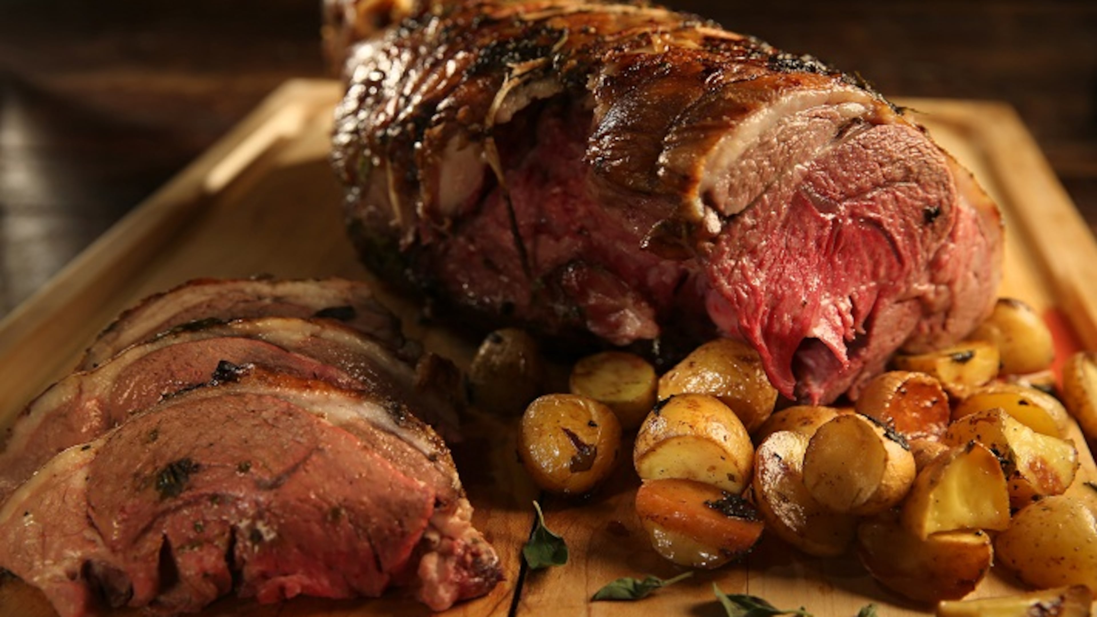 Little yellow potatoes roast up beautifully alongside a leg of lamb that has been slathered with a lemon, olive and herb rub. (Abel Uribe/Chicago Tribune/TNS)
