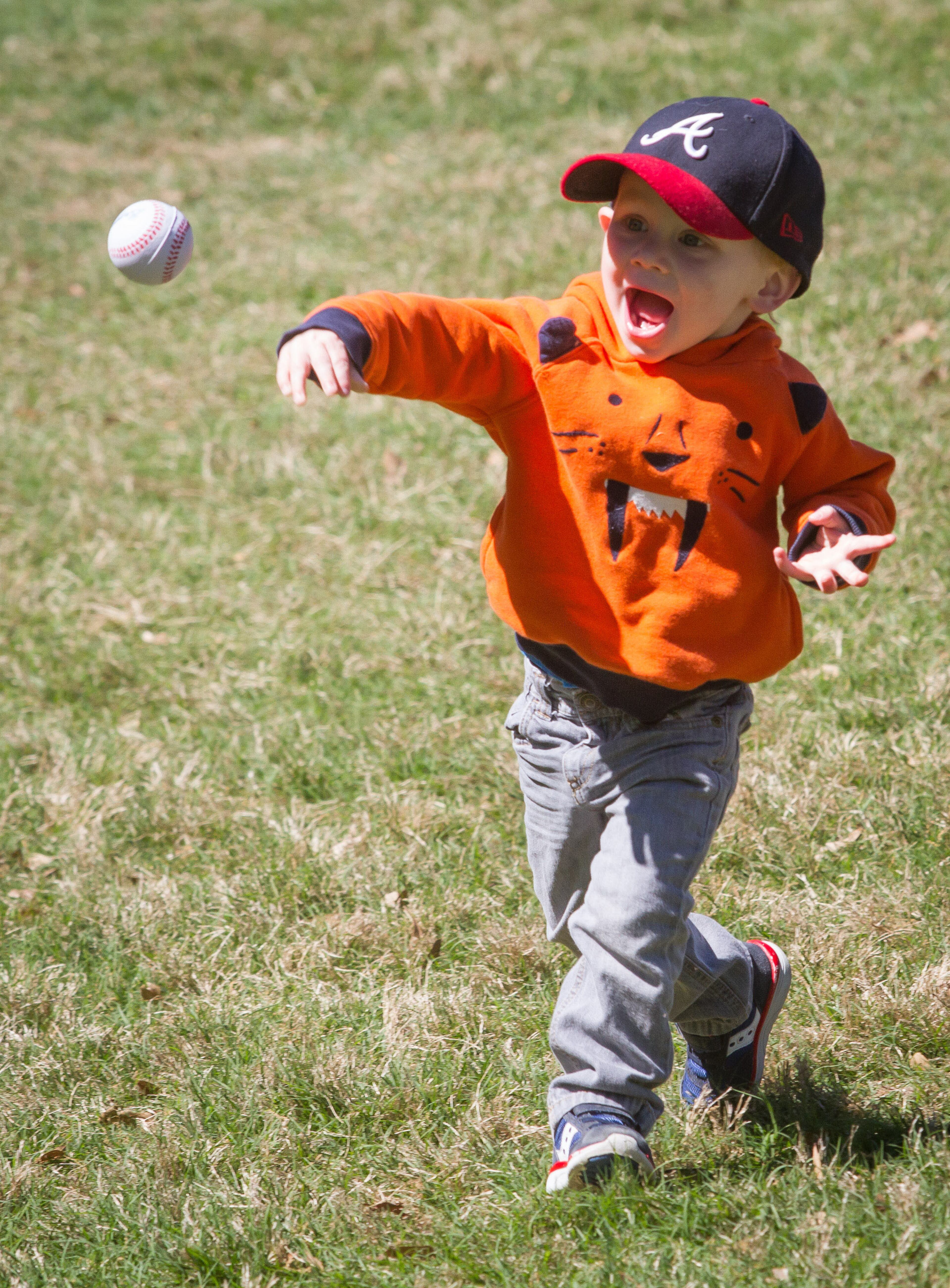Tate Culler plays with a ball while his family enjoys the 81st Annual Atlanta Dogwood Festival Saturday in Atlanta, Ga April 8, 2017. STEVE SCHAEFER / SPECIAL TO THE AJC