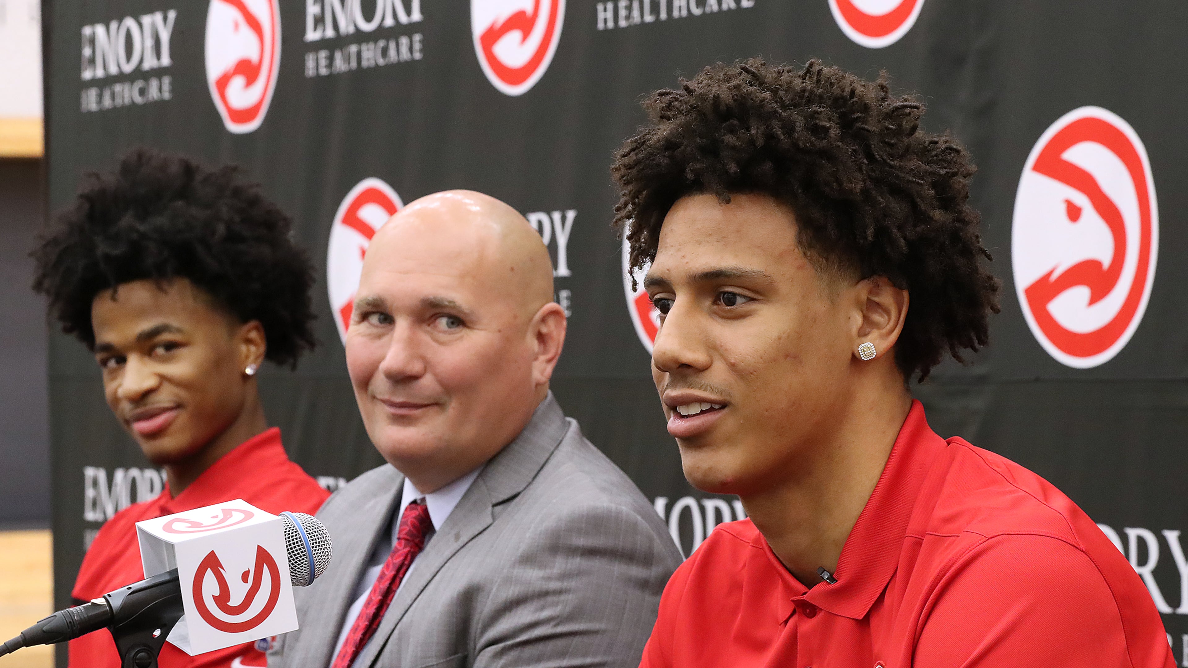 Atlanta Hawks President of Basketball Operations and General Manager Travis Schlenk (center) introduces Jalen Johnson (right, 20th overall pick) and Sharife Cooper (left, 48th overall pick) on Friday, July 30, 2021, in Atlanta. Curtis Compton / Curtis.Compton@ajc.com