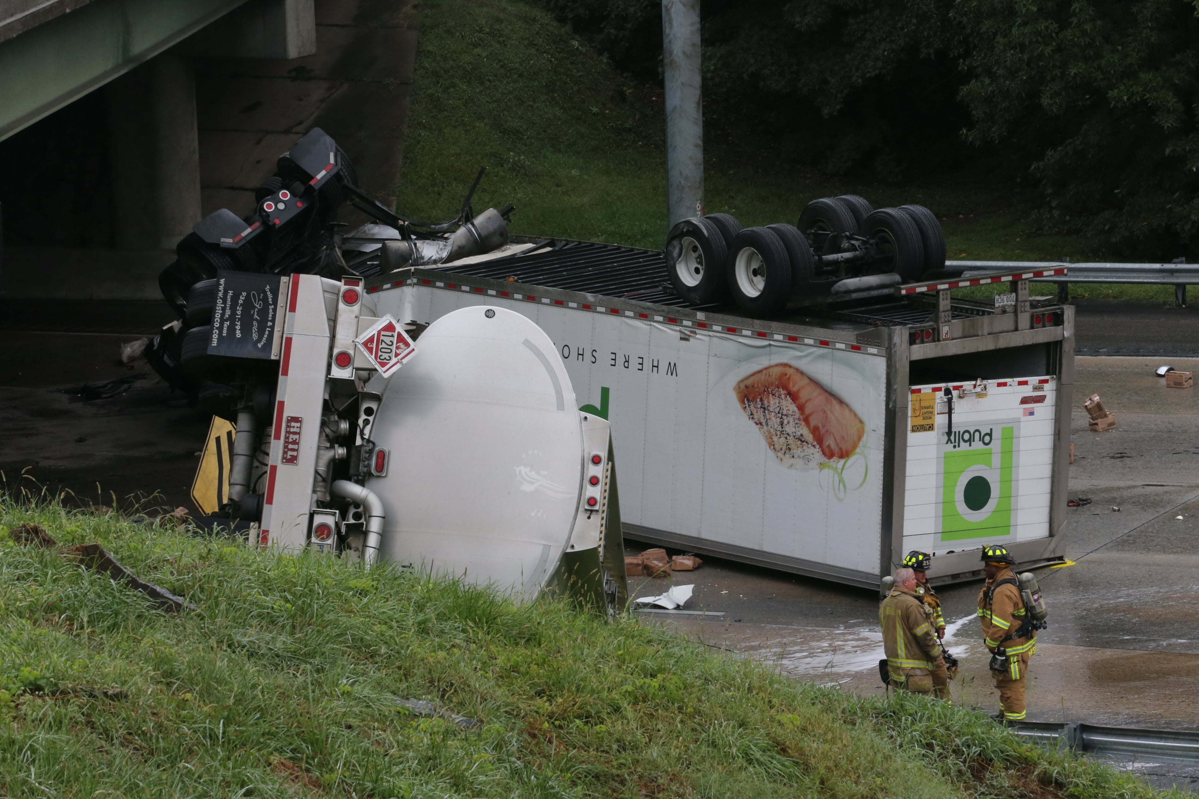 Two tractor-trailers plunged off I-285 onto Ga. 400, shutting down all northbound lanes of 400 and eastbound lanes of 285 during the Friday afternoon lunch hour. No injuries reported.