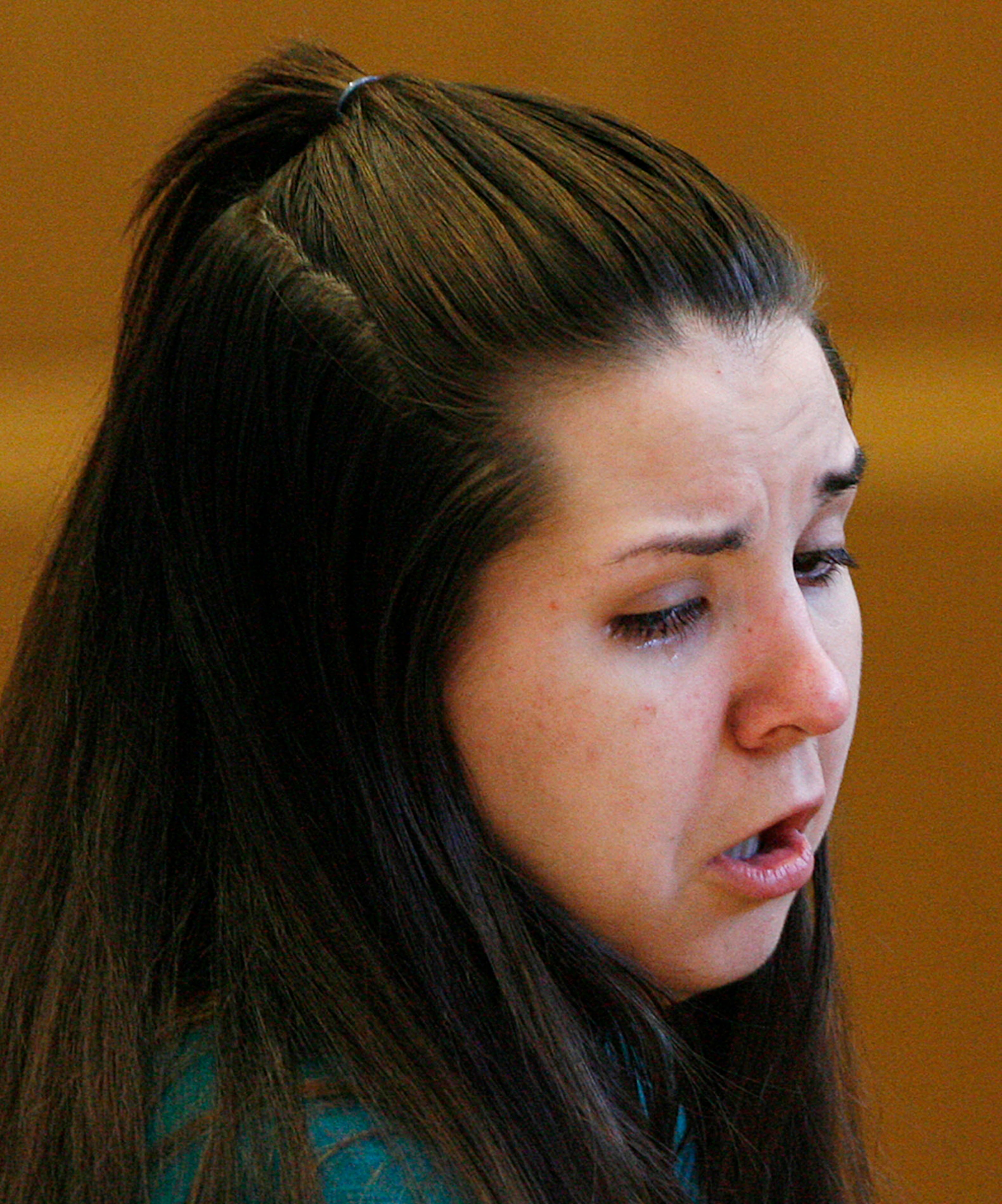 Jennifer Mee holds reacts as the jury selection begins in her murder trial, Tuesday, Sept. 17, 2013, at the Pinellas County Justice Center in Clearwater, Fla. Mee, 22, who found fame in 2007 as a teen because of her uncontrollable hiccupping, is charged with first-degree murder in the 2010 death of Shannon Griffin. (AP Photo/The Tampa Bay Times, Scott Keeler, Pool)