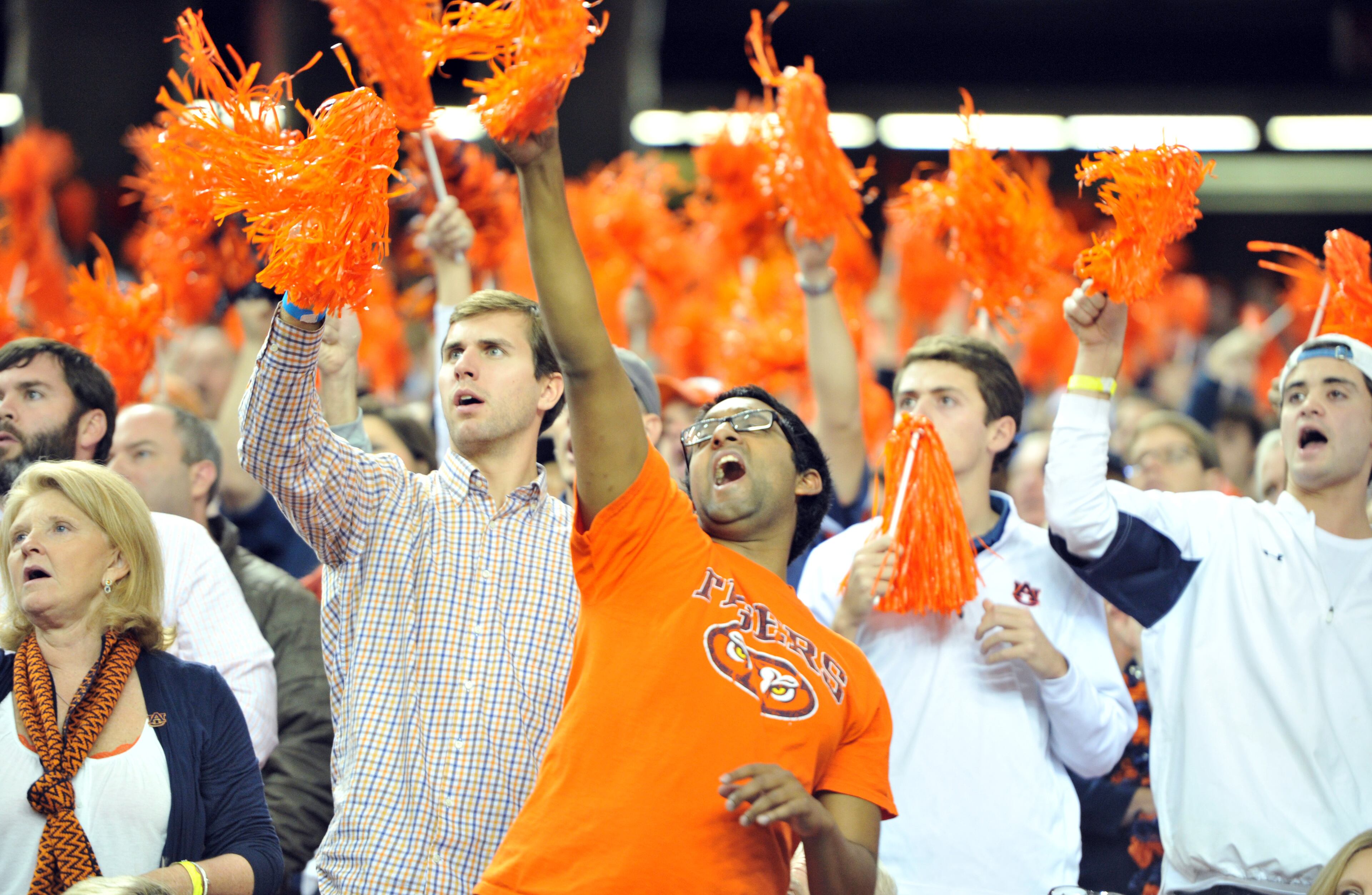 Auburn Tigers fans cheer for their team in the first half against the Missouri Tigers during the SEC Championship game at Georgia Dome on Saturday, December 7, 2013. HYOSUB SHIN / HSHIN@AJC.COM