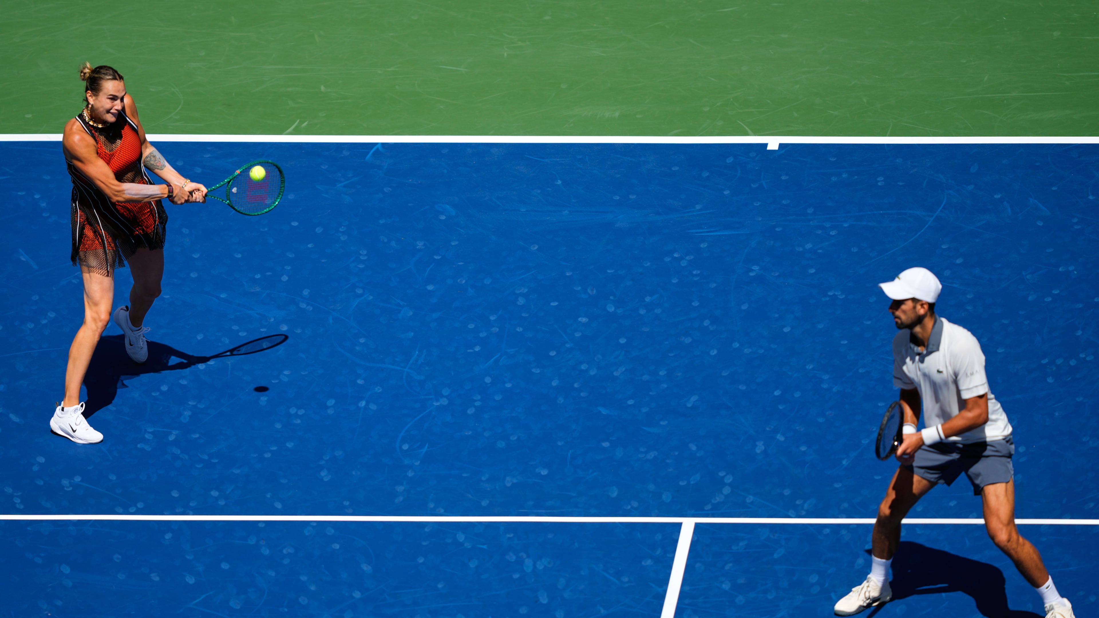 Aryna Sabalenka, of Belarus, and Novak Djokovic, of Serbia, during a mixed doubles match at the U.S. Open tennis championships, Tuesday, Aug. 25, 2026, in New York. (AP Photo/Yuki Iwamura)