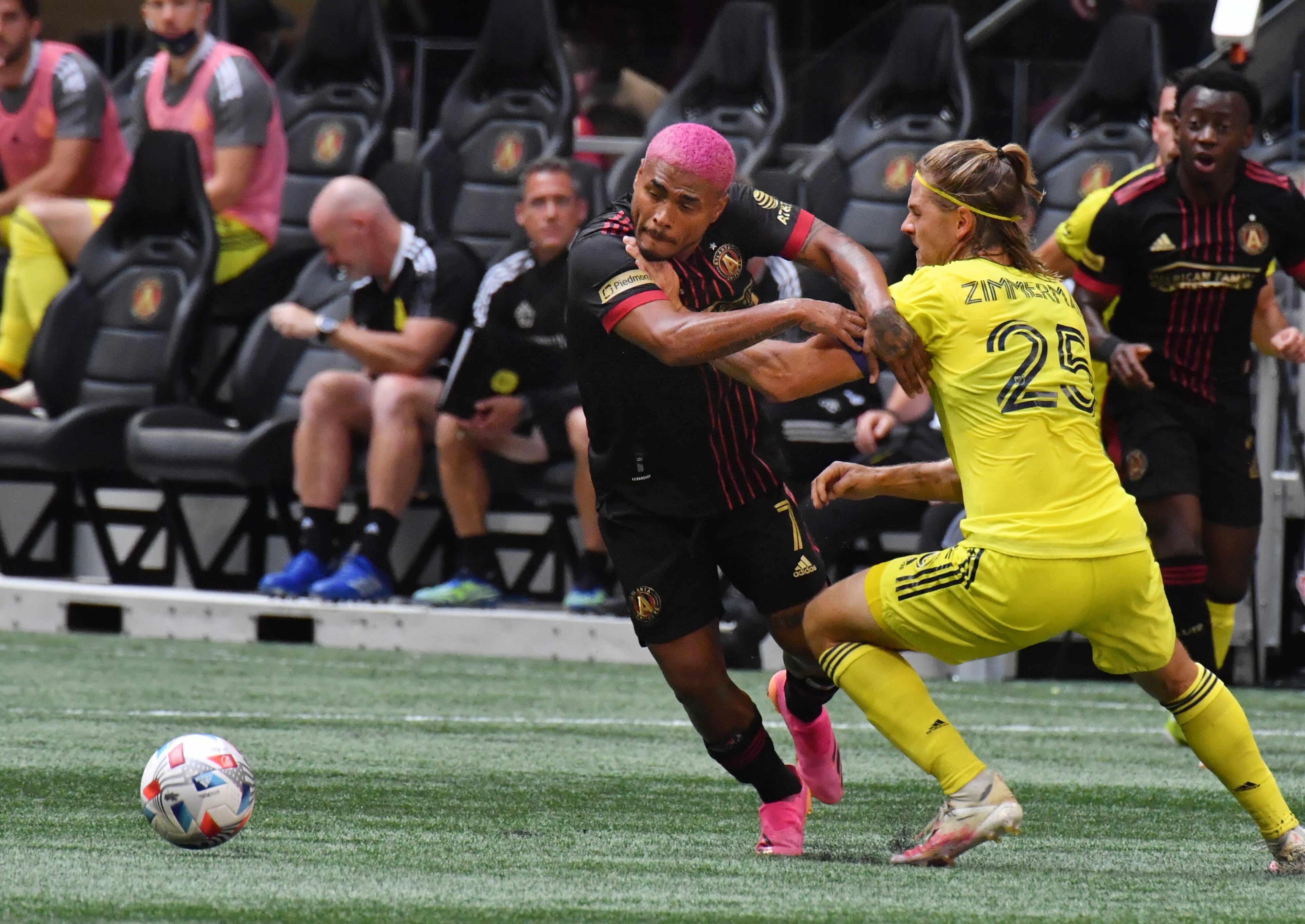 Atlanta United's forward Josef Martinez (7) works the ball against Nashville SC's defender Walker Zimmerman (25) during the first half in a MLS soccer match at at Mercedes-Benz Stadium in Atlanta on Saturday, August 28, 2021. (Hyosub Shin / Hyosub.Shin@ajc.com)